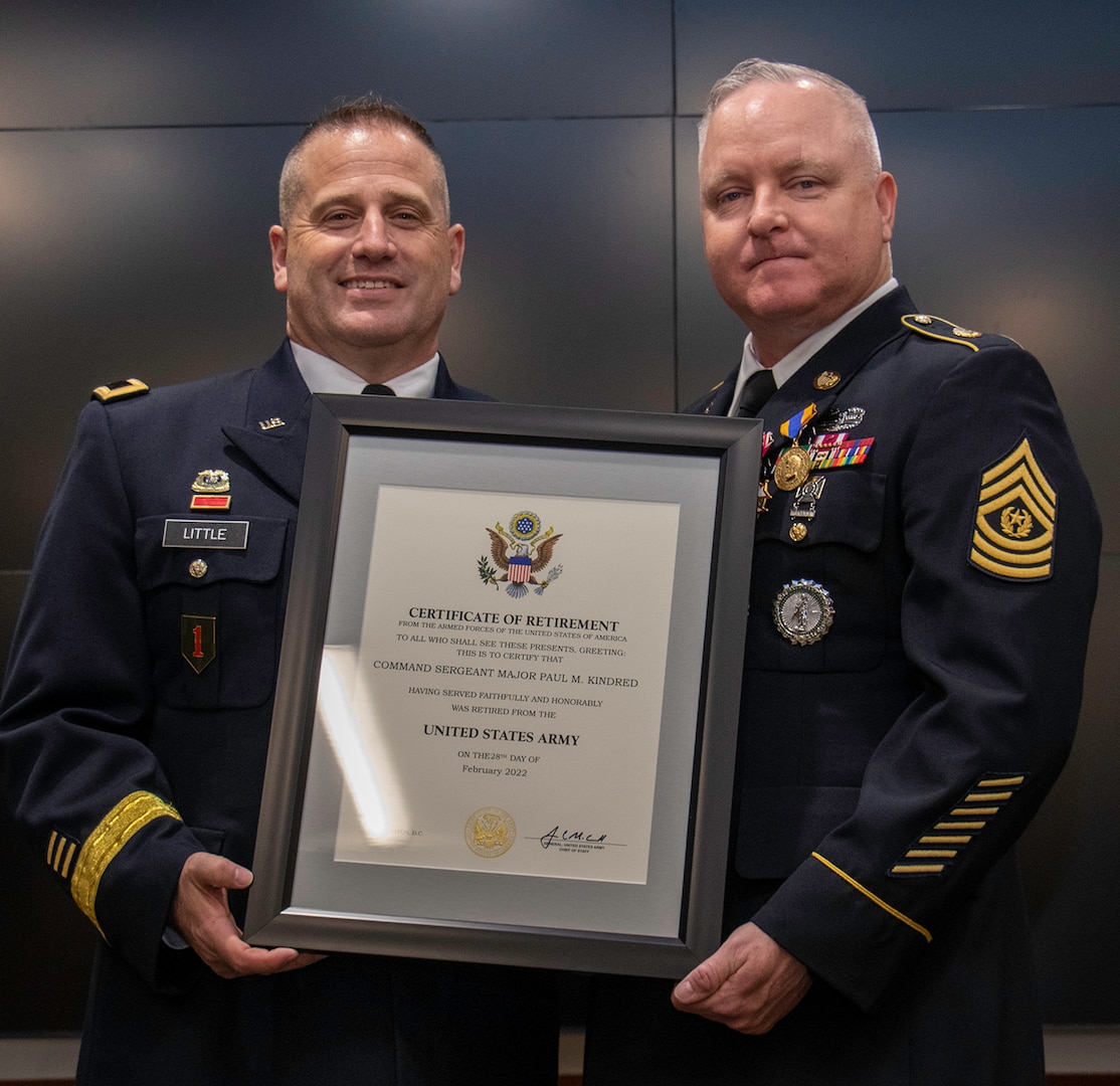 Command Sgt. Maj. Paul Kindred, of Jacksonville, Illinois, accepts the Certificate of Retirement from Maj. Gen. Eric Little, of Springfield, Illinois, Director of Manpower and Personnel, National Guard Bureau, in Washington, D.C., during Kindred’s retirement ceremony March 18 at the Illinois Military Academy, Camp Lincoln, Springfield, Illinois.