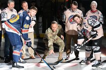 Lt. Gen. Daniel L. Karbler, commanding general, U.S. Army Space and Missile Defense Command, drops the ceremonial pregame puck during Military Appreciation Night at the Von Braun Center in Huntsville, Alabama, March 19. The Huntsville Havoc hosted the Peoria Rivermen. The evening included Soldiers rappelling from the ceiling, a future Soldier enlistment ceremony and a postgame jersey auction, featuring the jerseys worn by the Havoc players that night. Karbler also thanked Still Serving Veterans’ local chapter for sponsoring the event. (U.S. Army photo by Jason B. Cutshaw)