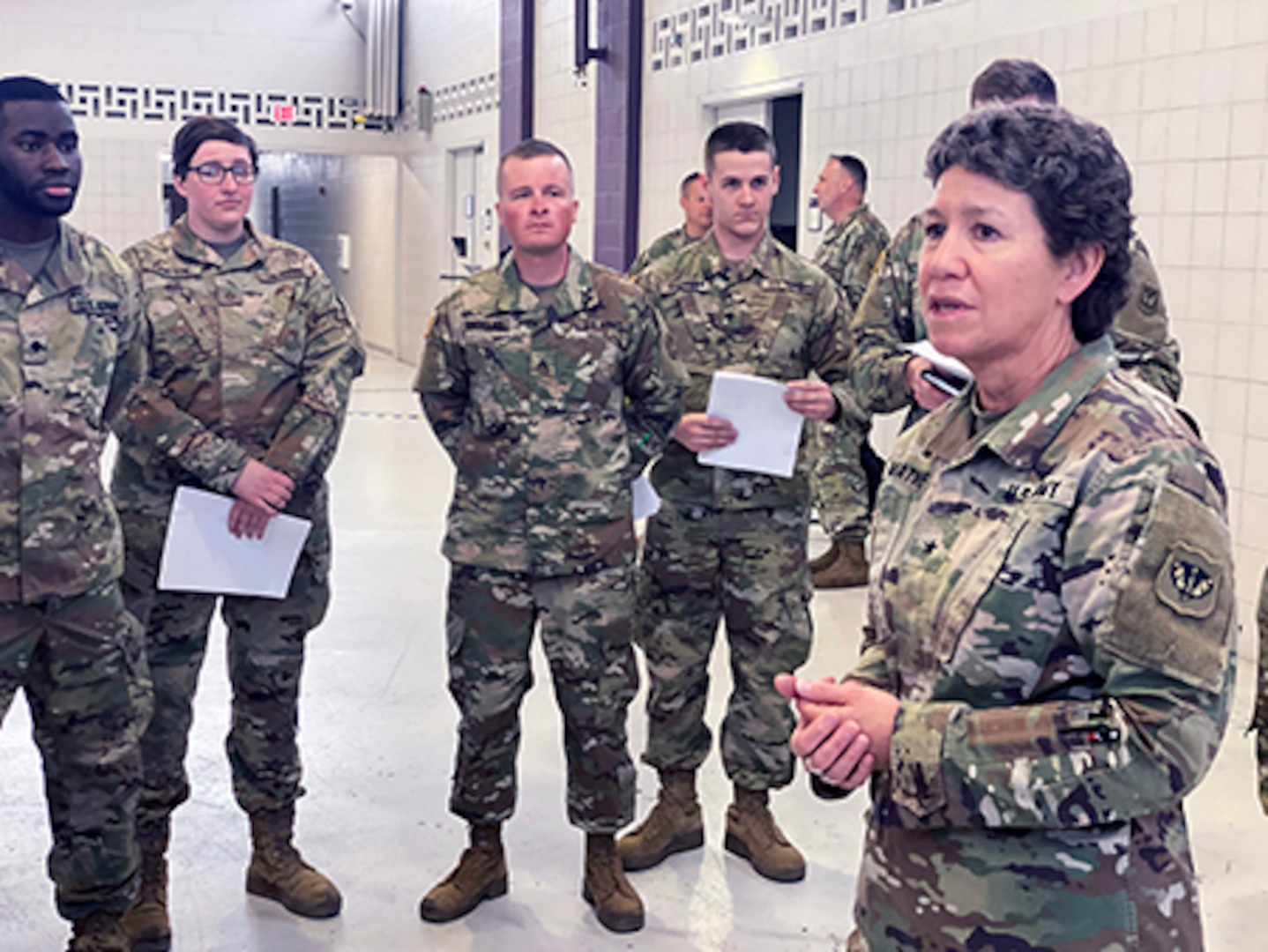 Brig. Gen. Joane Mathews, Wisconsin’s deputy adjutant general for Army, speaks March 12, 2020, to troops mobilizing for state active duty in response to the Wisconsin Department of Health Service’s request for assistance at the outset of the COVID-19 pandemic. Mathews is retiring after a career of firsts.