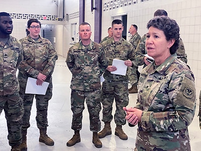 Brig. Gen. Joane Mathews, Wisconsin’s deputy adjutant general for Army, speaks March 12, 2020, to troops mobilizing for state active duty in response to the Wisconsin Department of Health Service’s request for assistance at the outset of the COVID-19 pandemic. Mathews is retiring after a career of firsts.