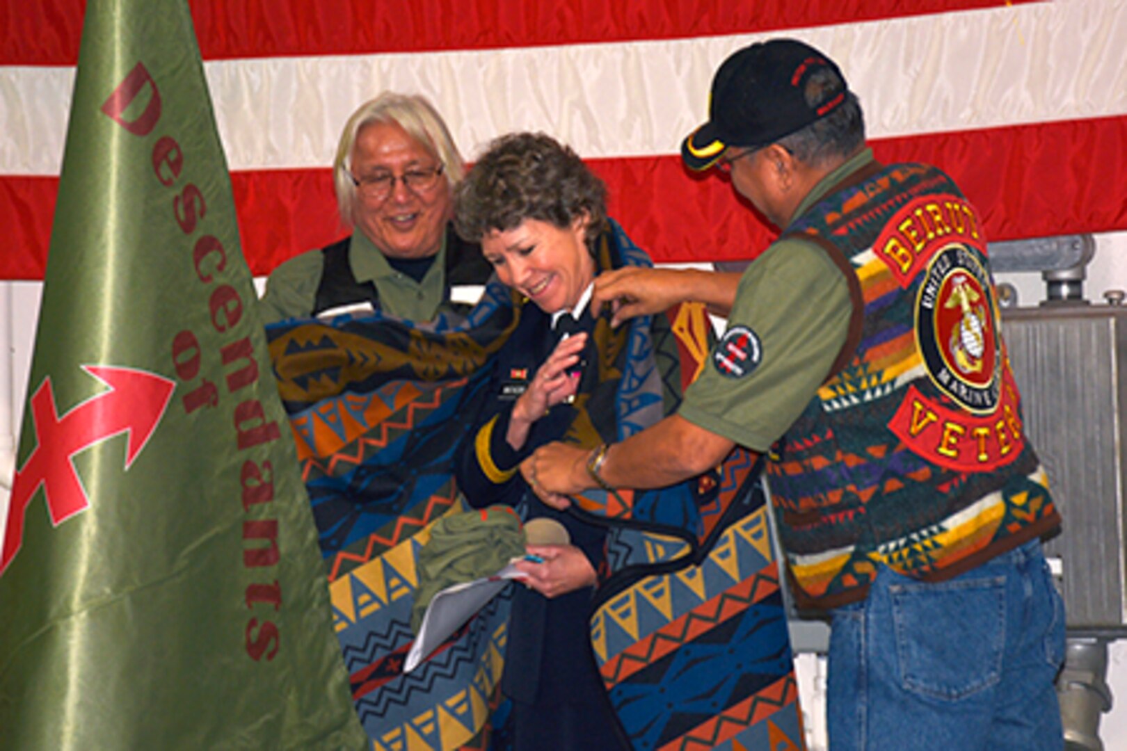 Wisconsin National Guard Brig. Gen. Joane Mathews receives a ceremonial blanket as a sign of respect and honor after speaking at the 40th Annual Descendants of Red Arrow Veterans Day Pow-Wow Nov. 11, 2017. The Volk Field ceremony honored 28 Native Americans who served in the Wisconsin National Guard’s Company D, 128th Infantry, 32nd Division, during World War I.