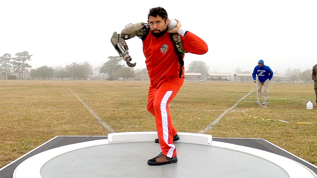 Wounded warrior throws shot put.