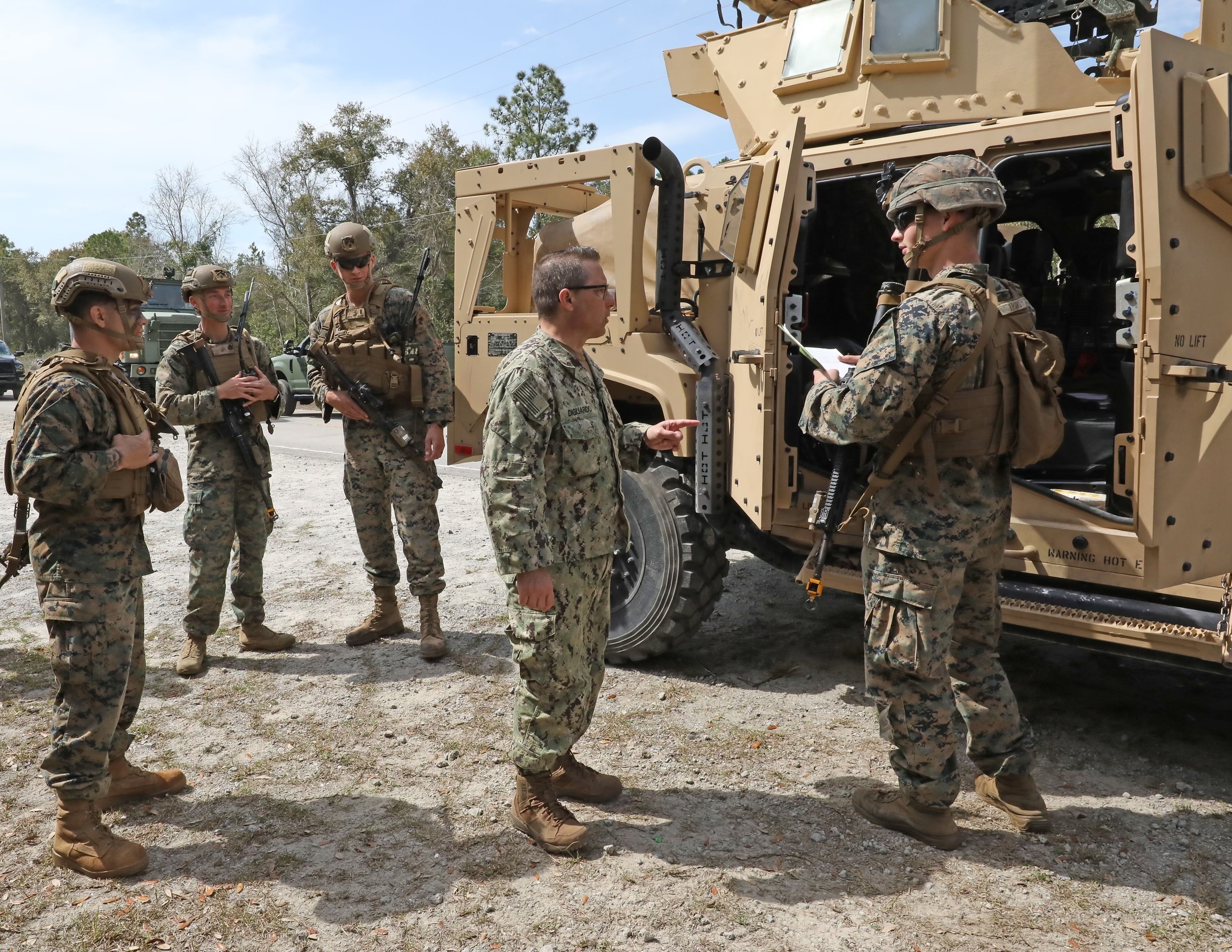 Rear Adm. Joseph DiGuardo, commander of Navy Expeditionary Combat Command talks with Marines at the Expeditionary Advanced Base entry control point during Fleet Battle Problem (FBP) 22-1.