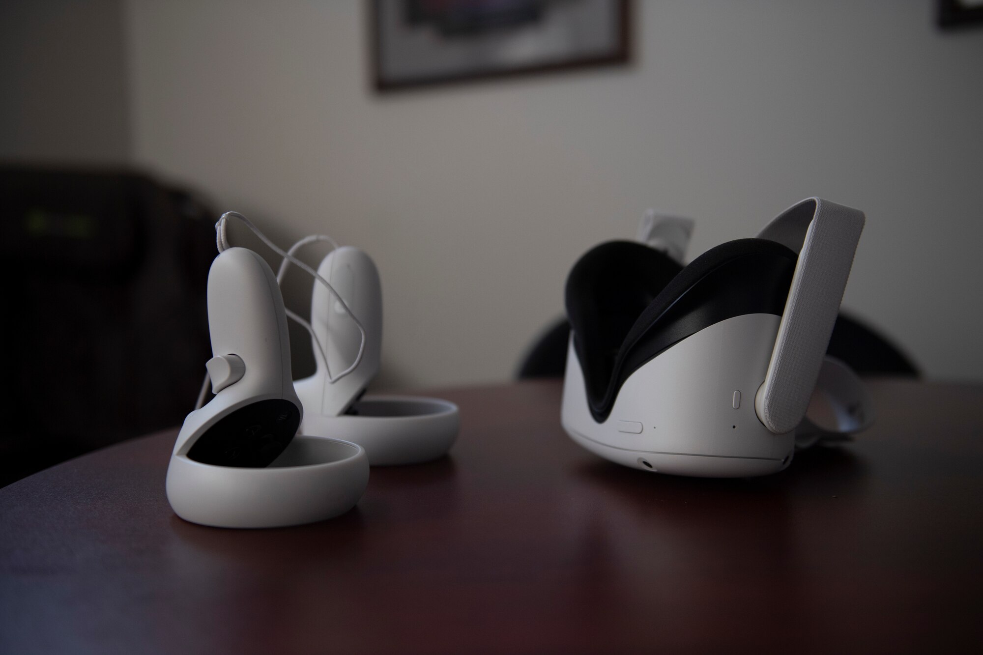 A photo of a VR headset sitting on a table.