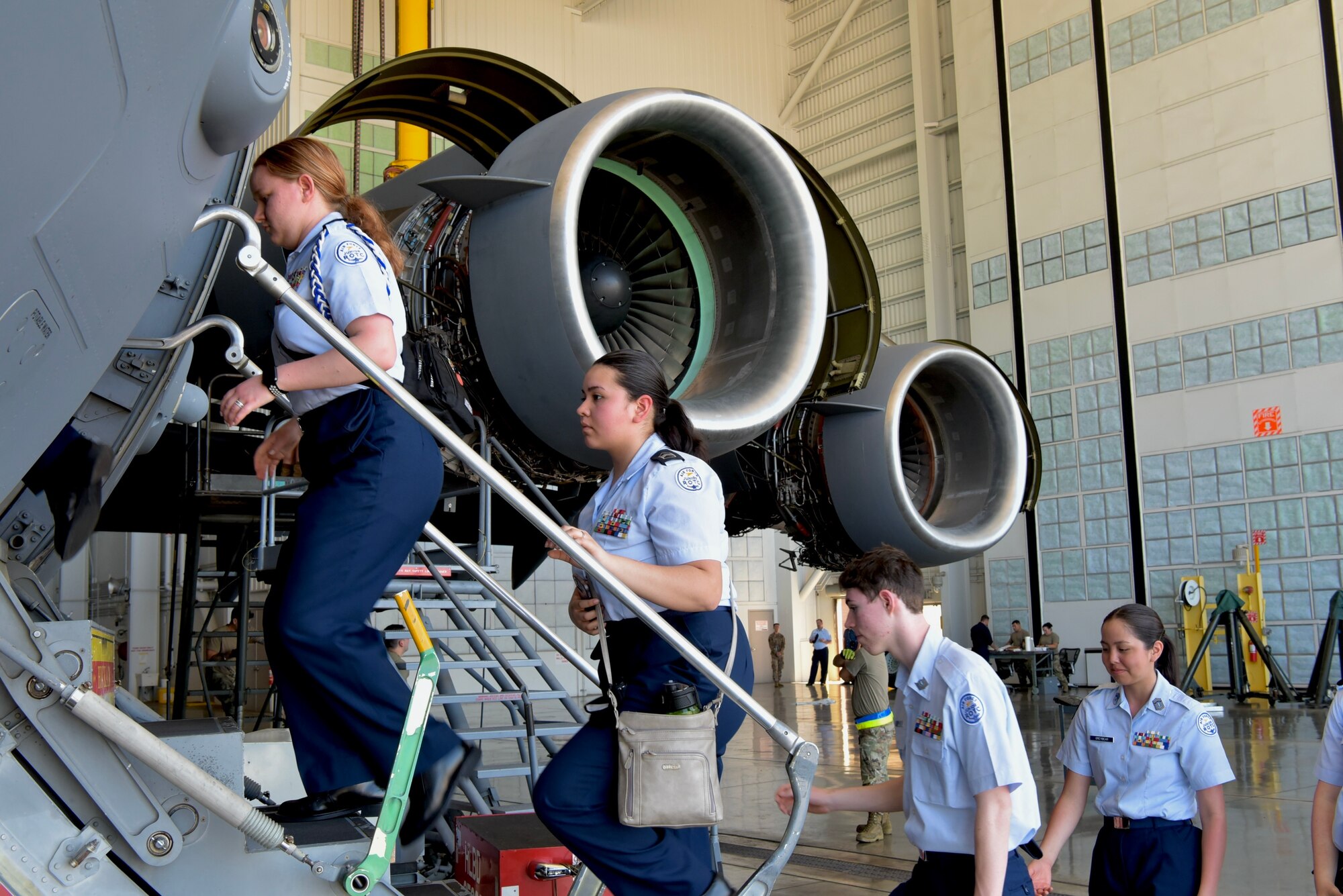 Cadets from West Anchorage High School Junior ROTC board a C-17 Globemaster III as part of a tour at Joint Base Pearl Harbor-Hickam, Hawaii, March 21, 2022. Cadets learned about the C-17’s capabilities and talked with 15th Wing maintainers about their career fields during a visit to JBPHH. (Air Force photo by 1st Lt. Benjamin Aronson)