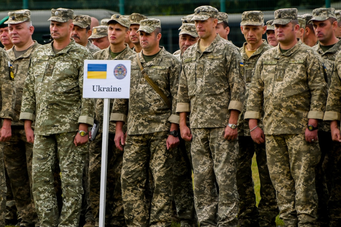 Ukraine service members stand in formation during an exercise.