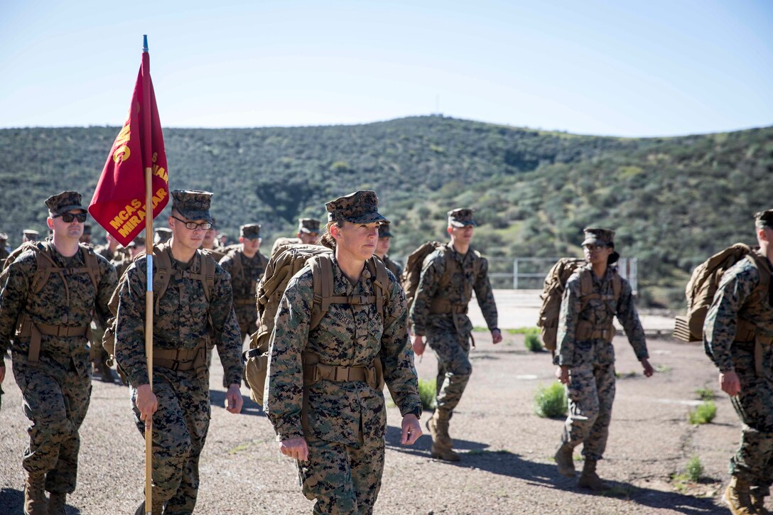 U.S. Marine Corps Lt. Col. Christine M. Houser, the commanding officer of Headquarters and Headquarters Squadron, Marine Corps Air Station Miramar, leads a squadron hike on MCAS Miramar, San Diego, California, Feb. 17, 2022. The squadron conducted a ten-mile conditioning hike to enhance combat fitness, build cohesion, and promote unit camaraderie throughout the squadron. (U.S. Marine Corps photo by Lance Cpl. Jose GuerreroDeLeon)