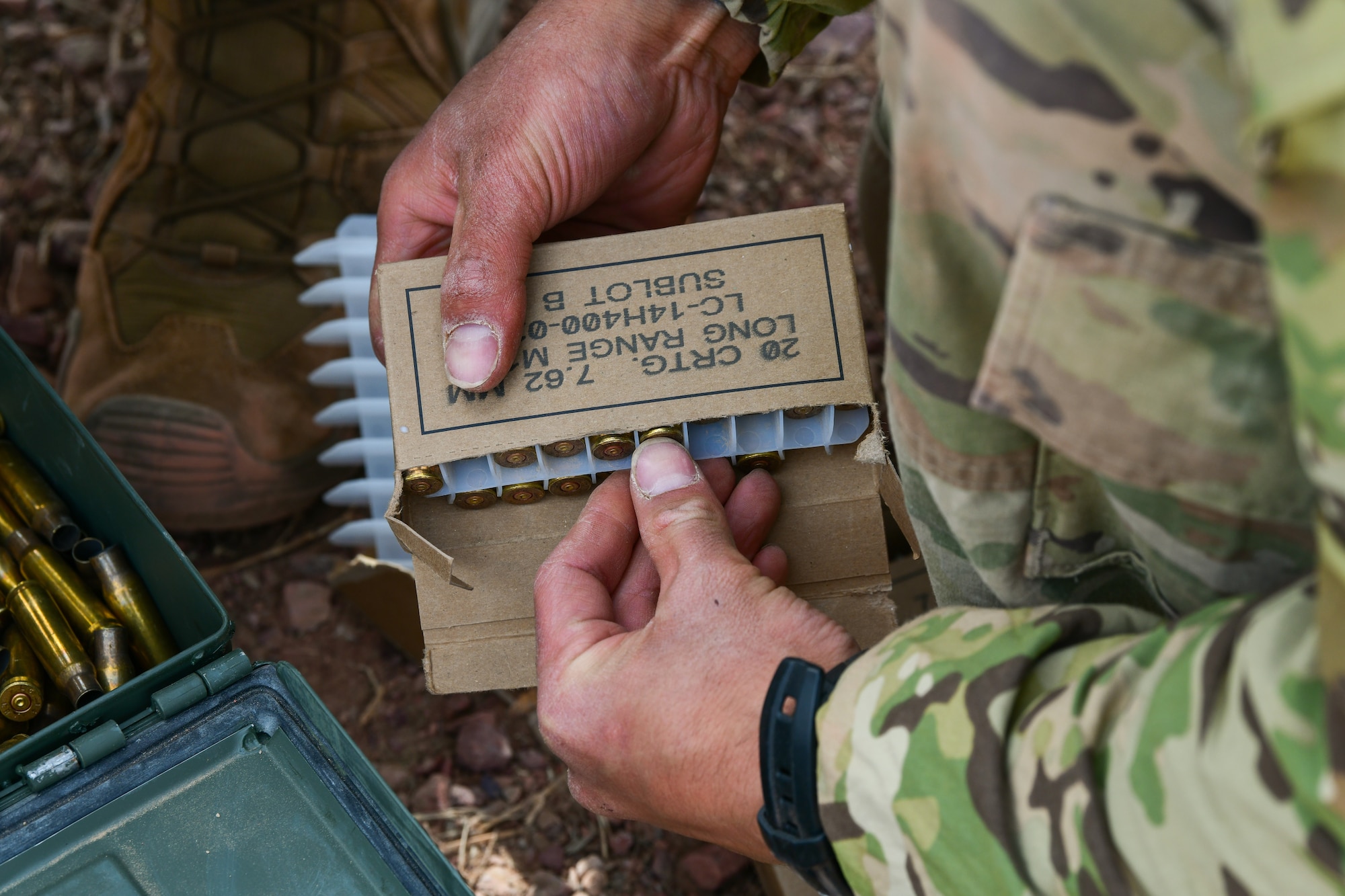 Airmen sort ammo.