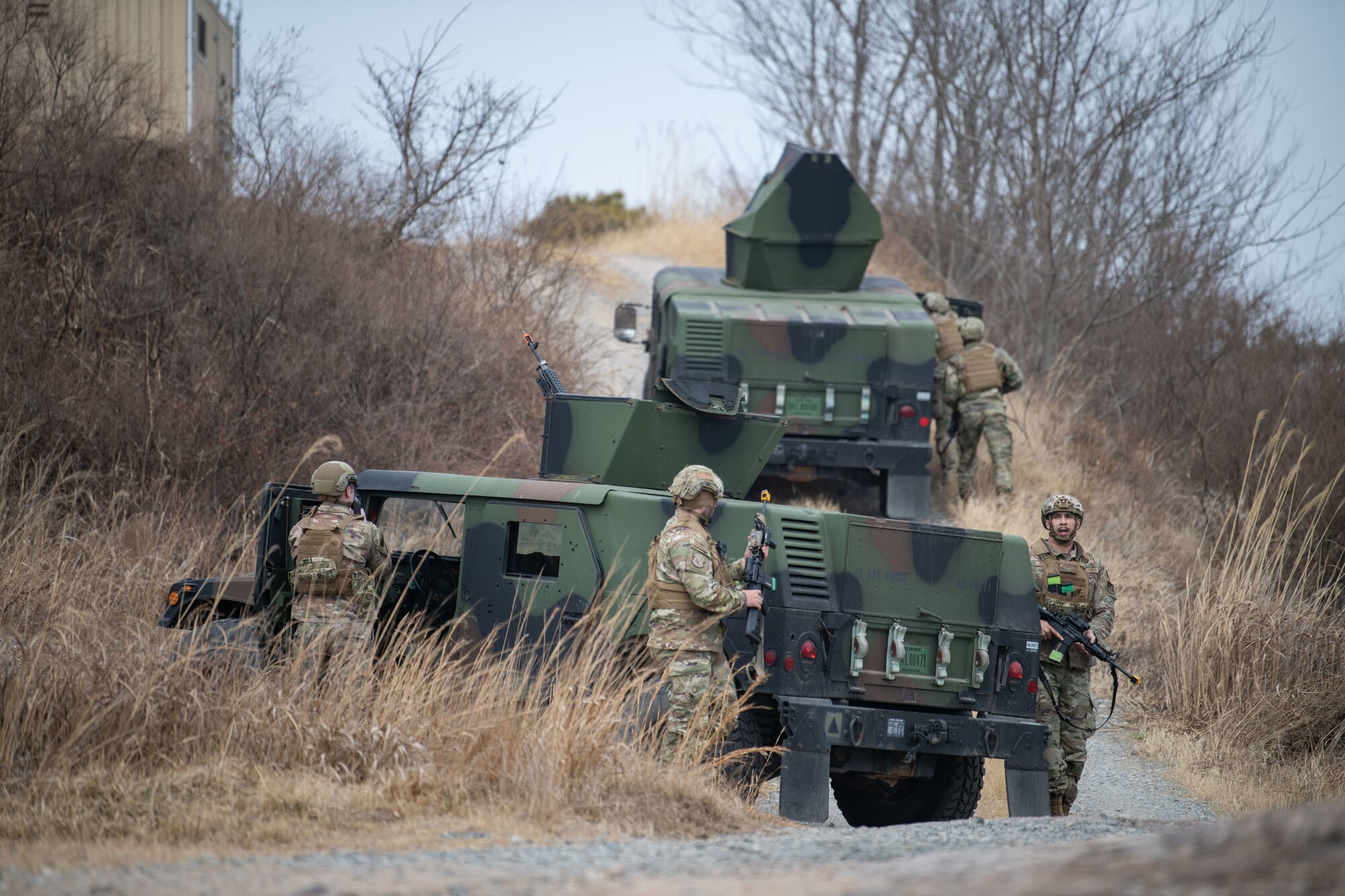 Airmen assigned to the 8th Security Forces Squadron collect and debrief after participating in simulated ground attack training at Kunsan Air Base, Republic of Korea, March 10, 2022.