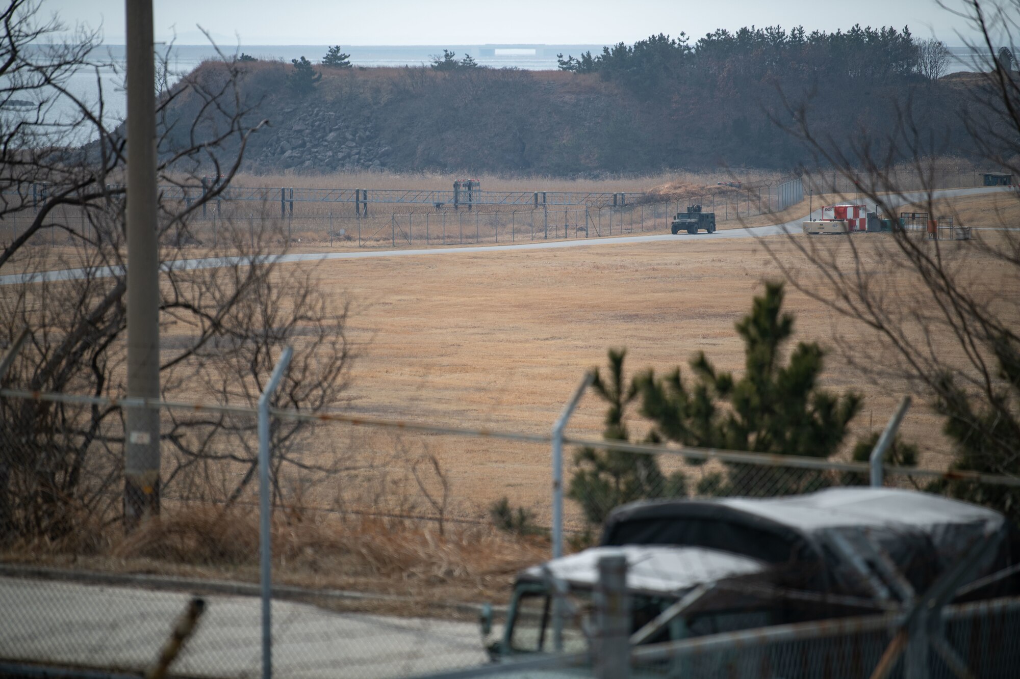 Airmen assigned to the 8th Security Forces Squadron collect and debrief after participating in simulated ground attack training at Kunsan Air Base, Republic of Korea, March 10, 2022.