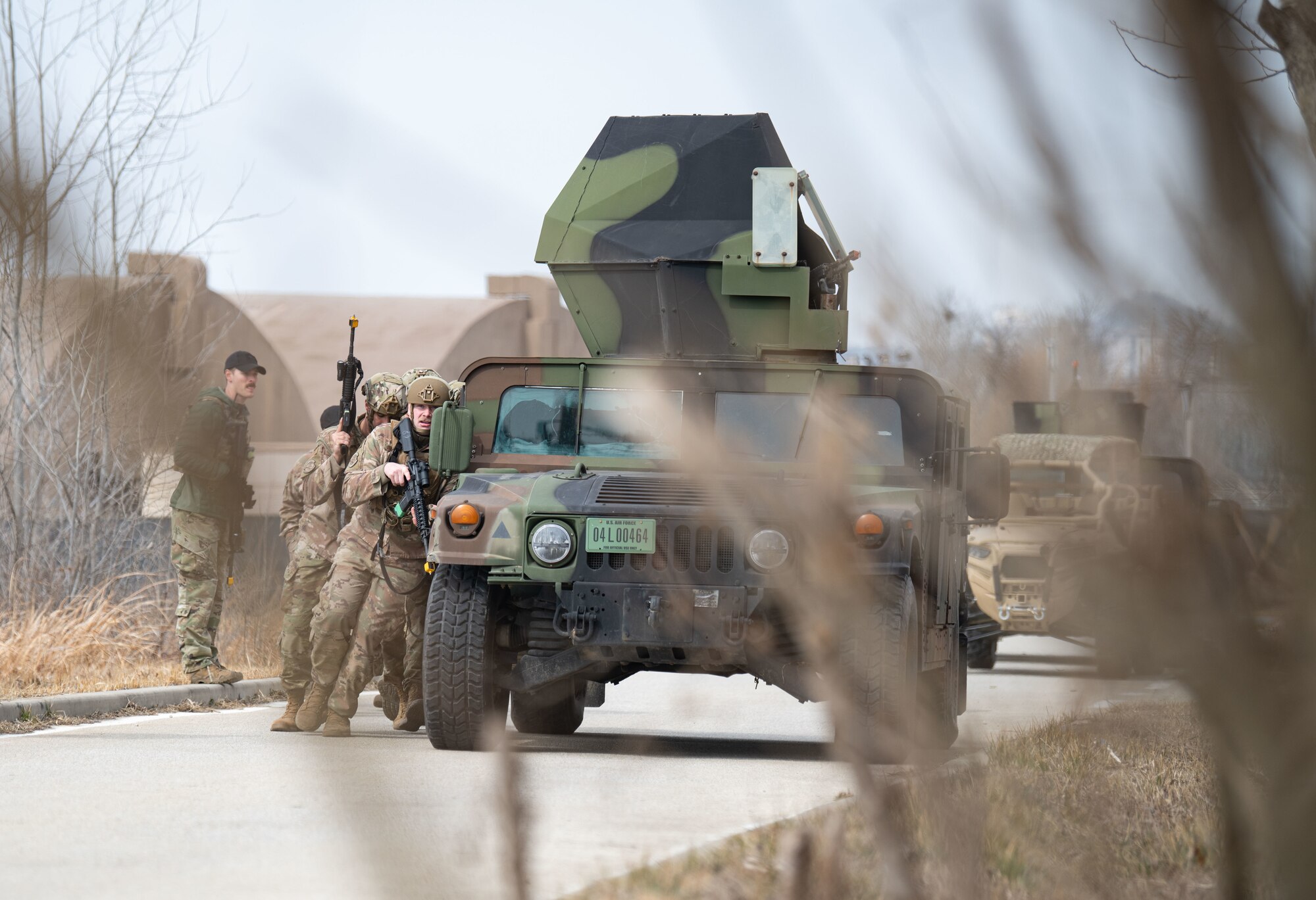Airmen assigned to the 8th Security Forces Squadron collect and debrief after participating in simulated ground attack training at Kunsan Air Base, Republic of Korea, March 10, 2022.