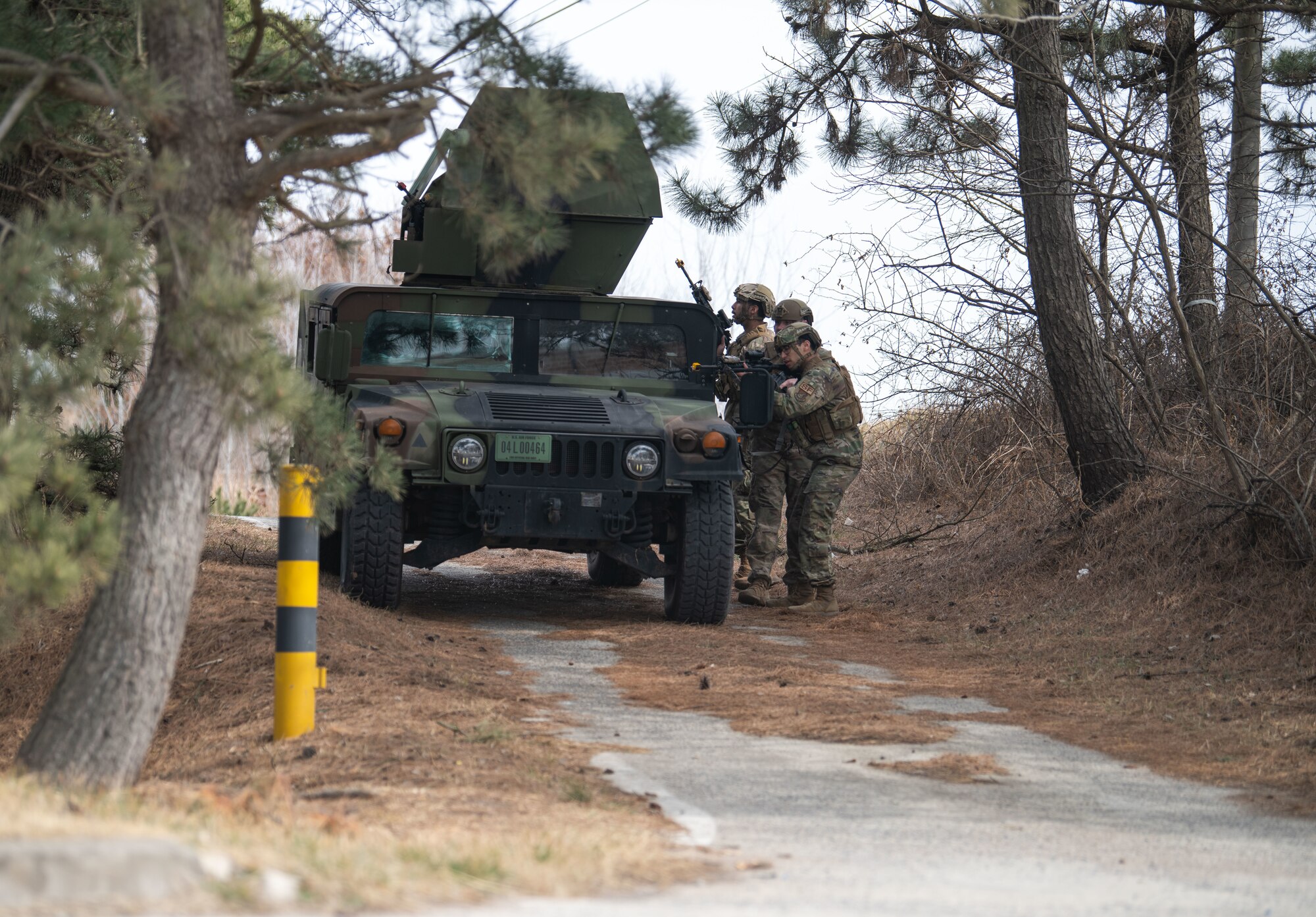 Airmen assigned to the 8th Security Forces Squadron collect and debrief after participating in simulated ground attack training at Kunsan Air Base, Republic of Korea, March 10, 2022.