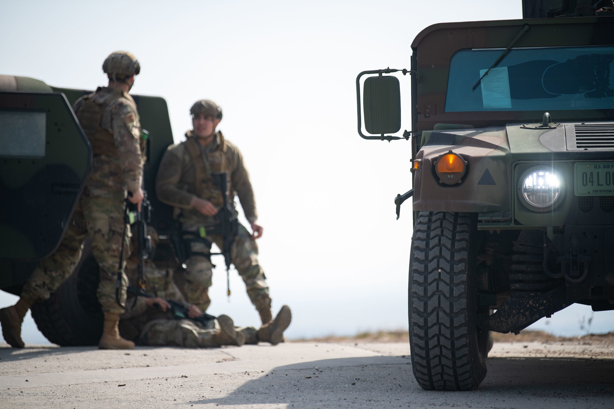 Airmen assigned to the 8th Security Forces Squadron collect and debrief after participating in simulated ground attack training at Kunsan Air Base, Republic of Korea, March 10, 2022.