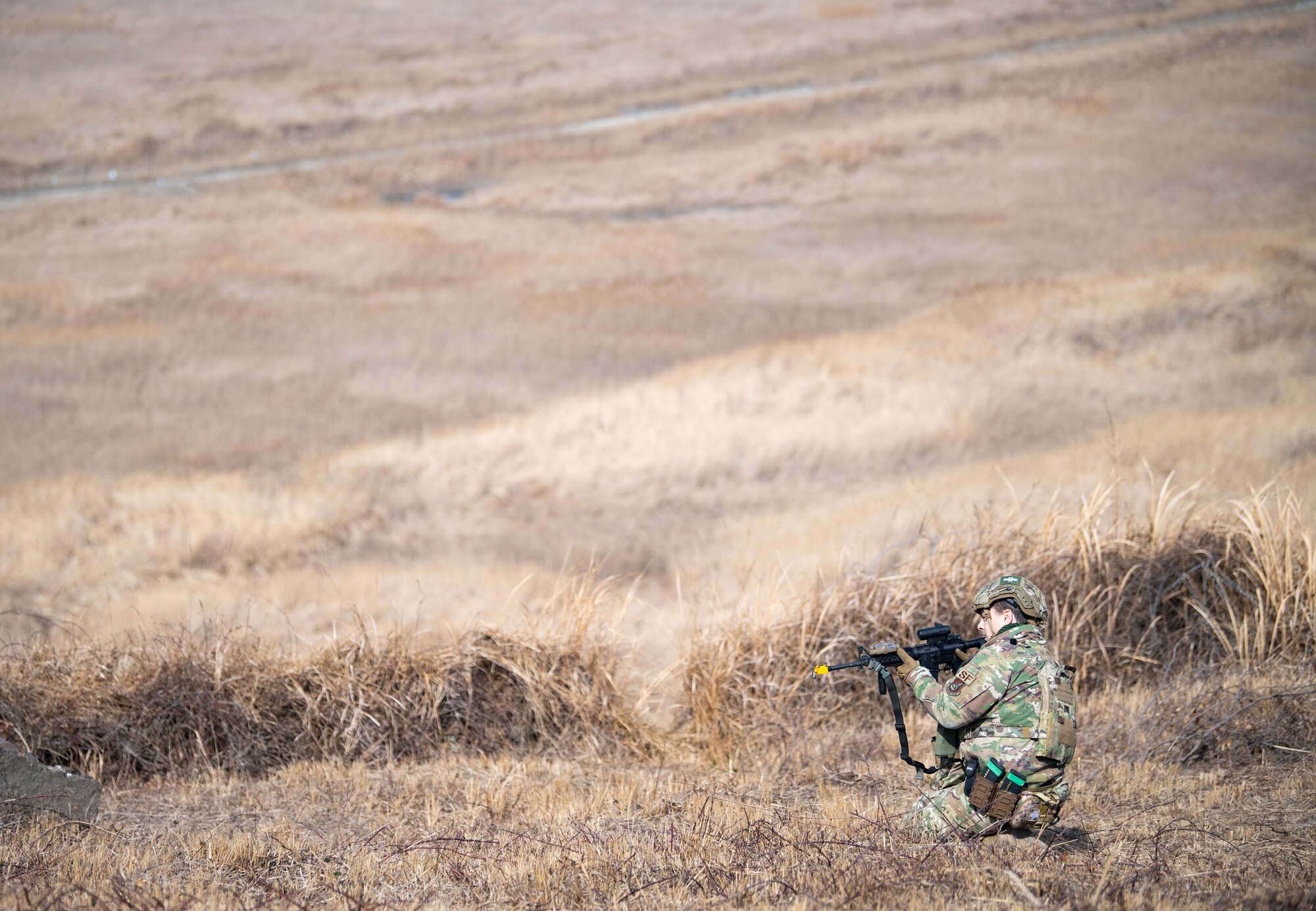 Airmen assigned to the 8th Security Forces Squadron collect and debrief after participating in simulated ground attack training at Kunsan Air Base, Republic of Korea, March 10, 2022.