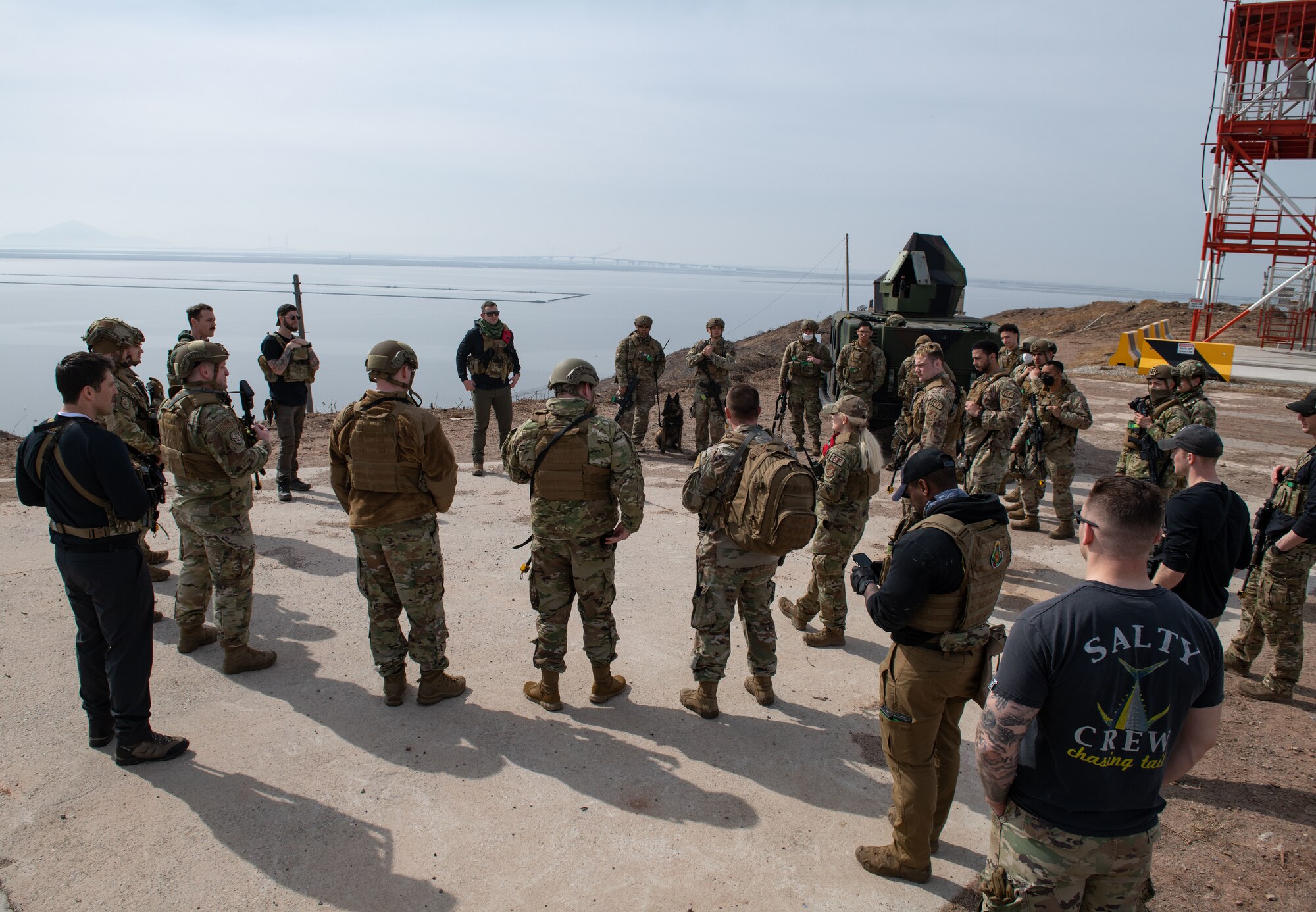 Airmen assigned to the 8th Security Forces Squadron collect and debrief after participating in simulated ground attack training at Kunsan Air Base, Republic of Korea, March 10, 2022.