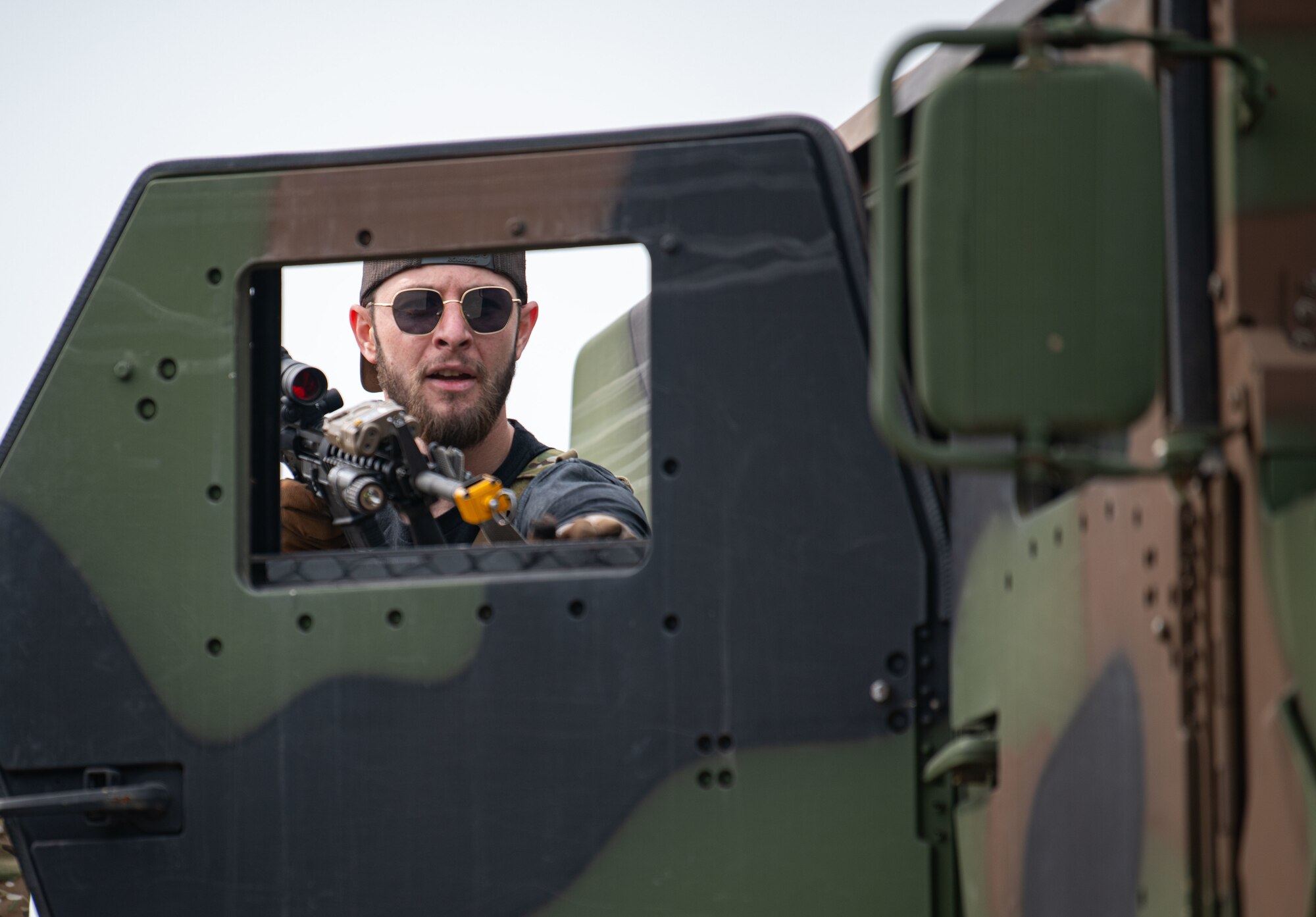 Airmen acting as an opposing force strike team prepare to ambush 8th Security Forces Squadron Defenders in order to test their ability to rapidly respond and counter base threats at Kunsan Air Base, Republic of Korea, March 10, 2022.