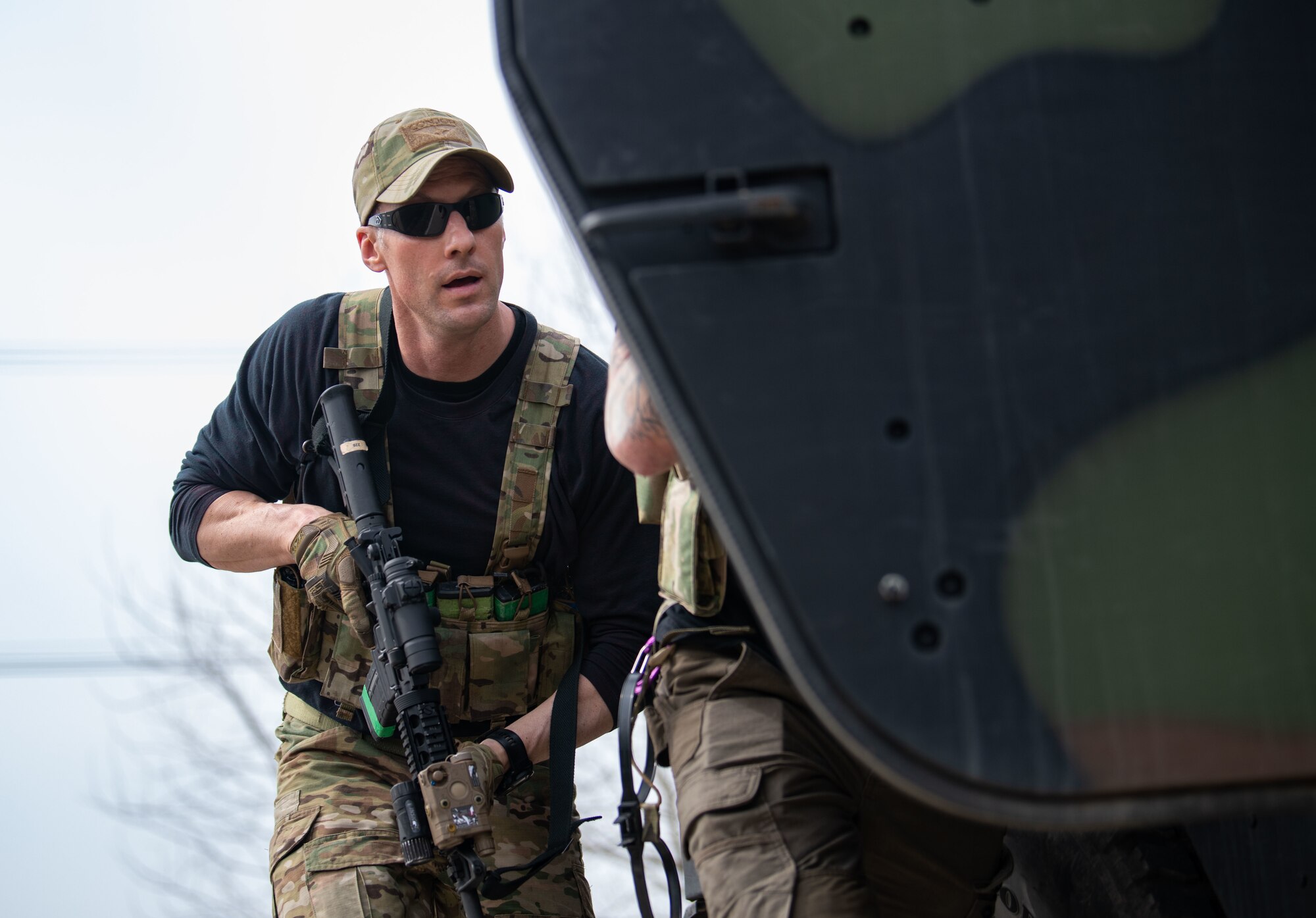 Airmen acting as an opposing force strike team prepare to ambush 8th Security Forces Squadron Defenders in order to test their ability to rapidly respond and counter base threats at Kunsan Air Base, Republic of Korea, March 10, 2022.