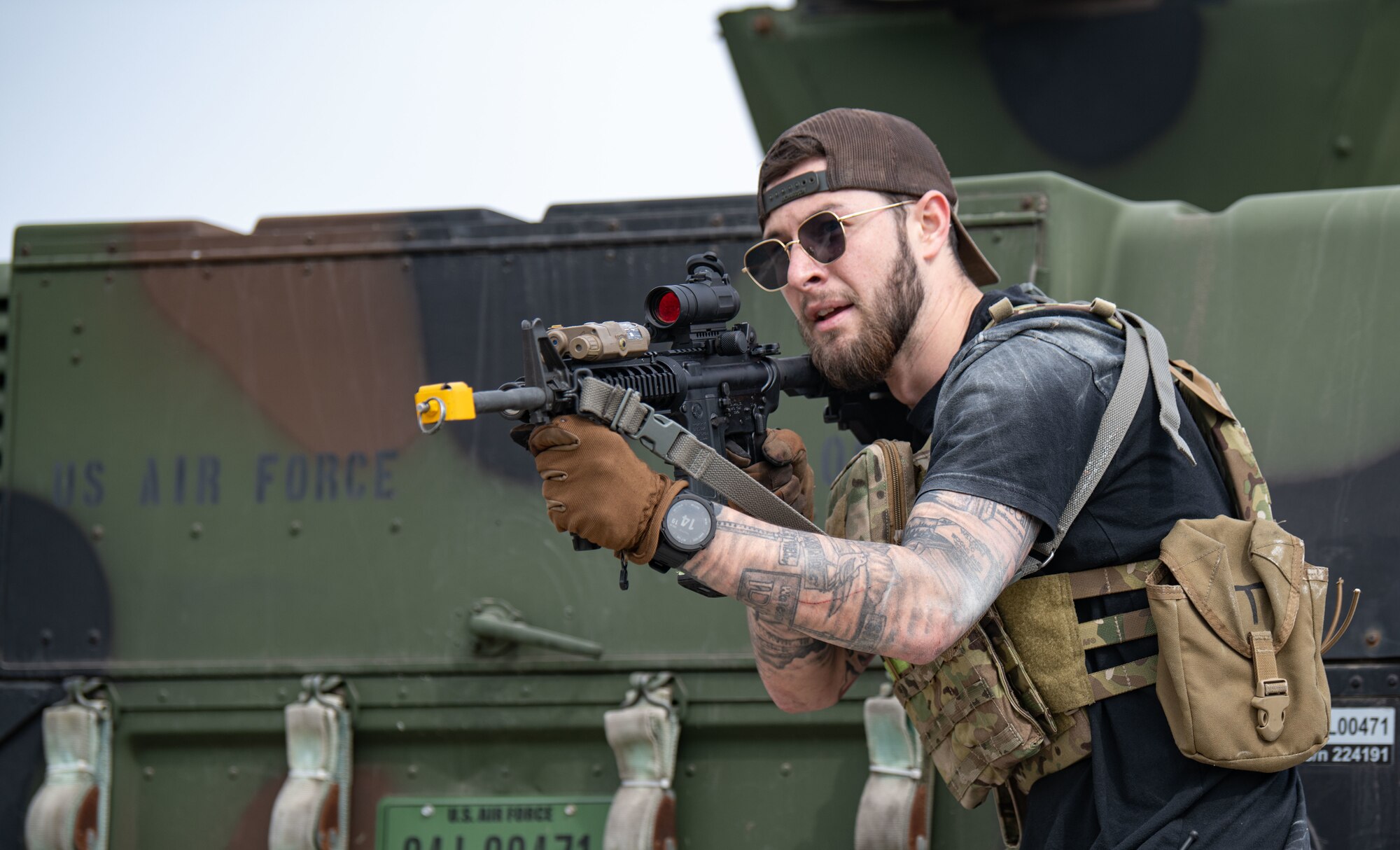 Airmen acting as an opposing force strike team prepare to ambush 8th Security Forces Squadron Defenders in order to test their ability to rapidly respond and counter base threats at Kunsan Air Base, Republic of Korea, March 10, 2022.
