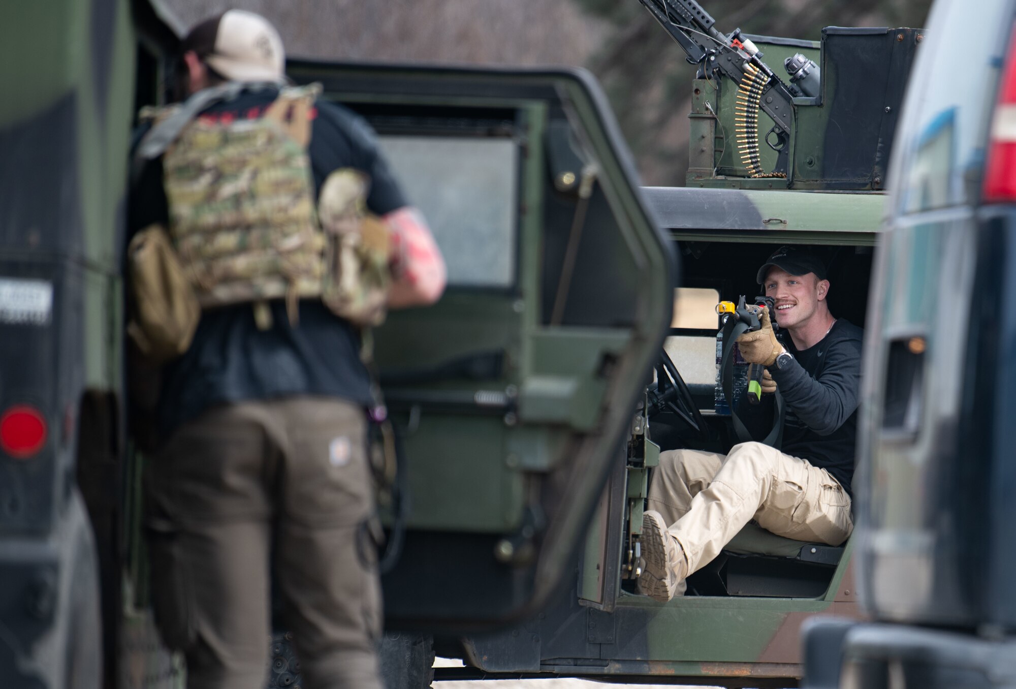 Airmen acting as an opposing force strike team prepare to ambush 8th Security Forces Squadron Defenders in order to test their ability to rapidly respond and counter base threats at Kunsan Air Base, Republic of Korea, March 10, 2022.