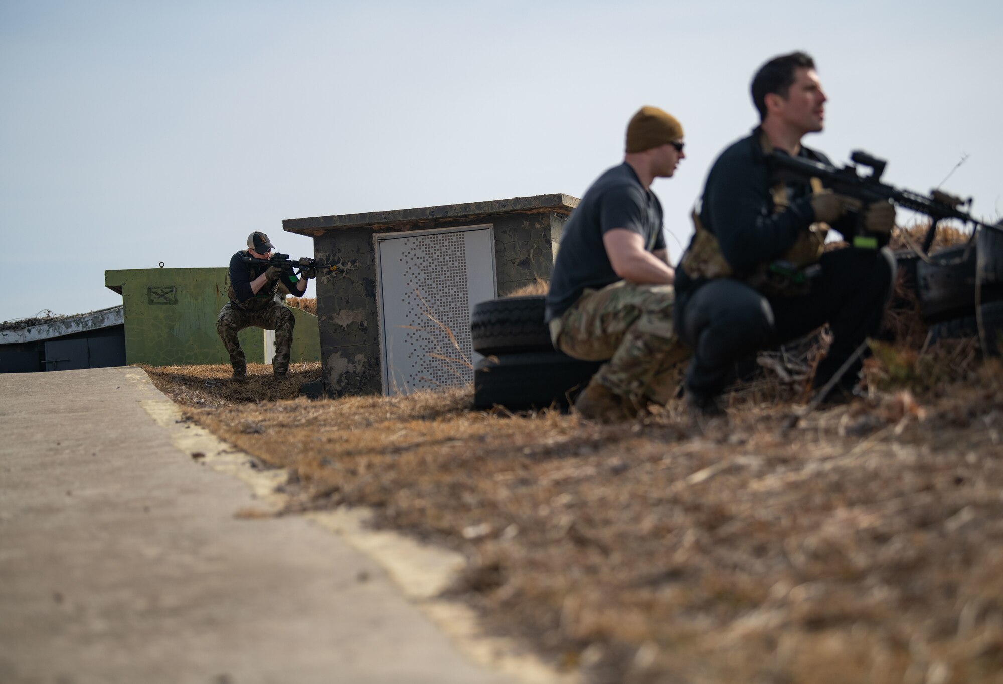 Airmen acting as an opposing force strike team prepare to ambush 8th Security Forces Squadron Defenders in order to test their ability to rapidly respond and counter base threats at Kunsan Air Base, Republic of Korea, March 10, 2022.