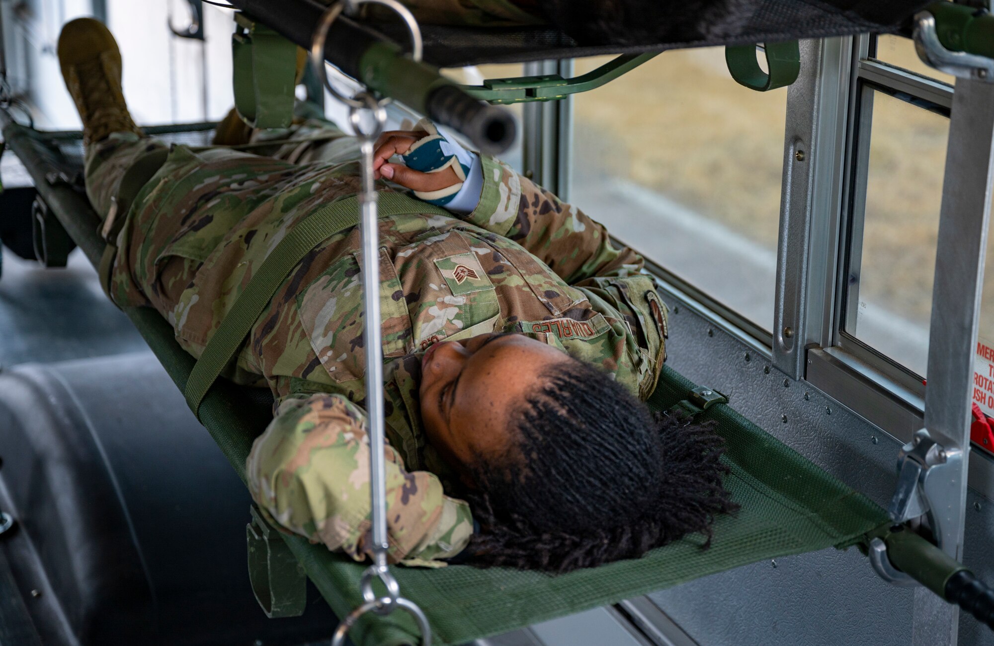 Airmen assigned to the 8th Medical Group carry a mock-casualty to a C-12 Huron during training at Kunsan Air Base, Republic of Korea, March 11, 2022.