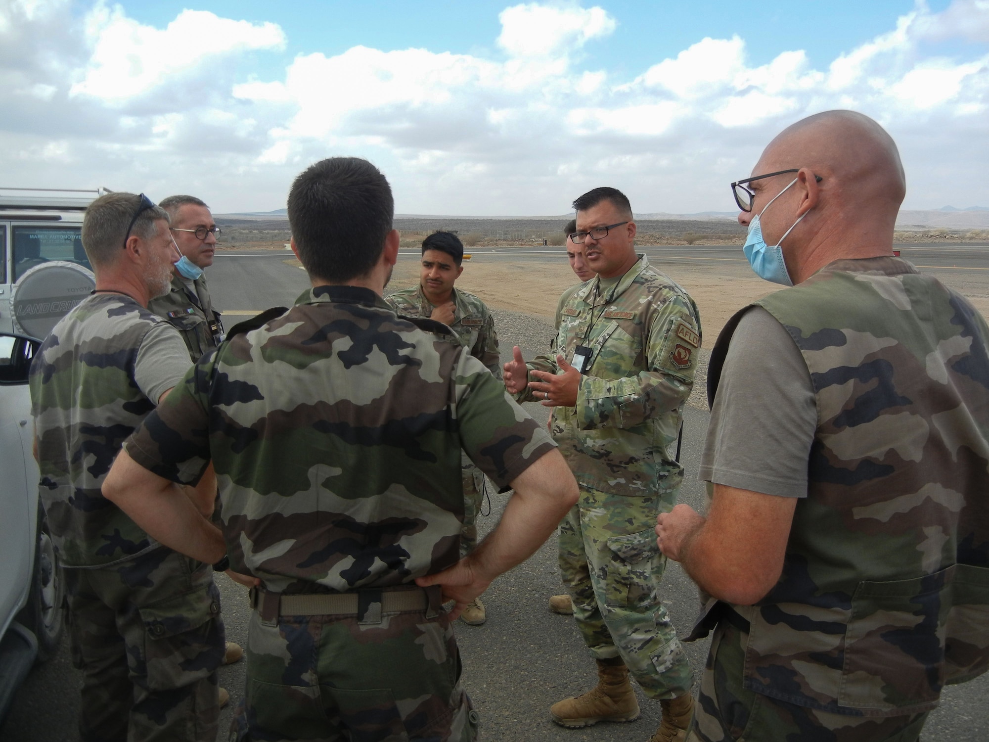 Airmen from the 776th Expeditionary Air Base Squadron airfield operations flight hosted members from the French military to discuss runway repairs at Chabelley Airfield (CADJ), Djibouti, March 10, 2022. As a part of a trilateral agreement, CADJ is a French installation operated by the United States in the country of Djibouti demonstrating the various partnerships and alliances the U.S. relies on to strengthen defense institutions and counter a multitude of threats to ensure a more stable, prosperous Africa. (U.S. courtesy photo by Tech. Sgt. Joel Yerkey)