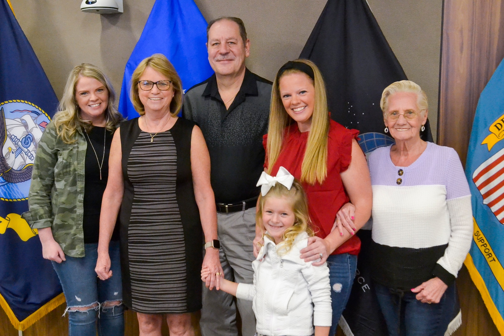 Shirley Keyser, second from left, poses with her family during her retirement ceremony at Defense Logistics Agency Troop Support March 21, 2022, in Philadelphia. Kyser is retiring after 31 years of service with the organization.