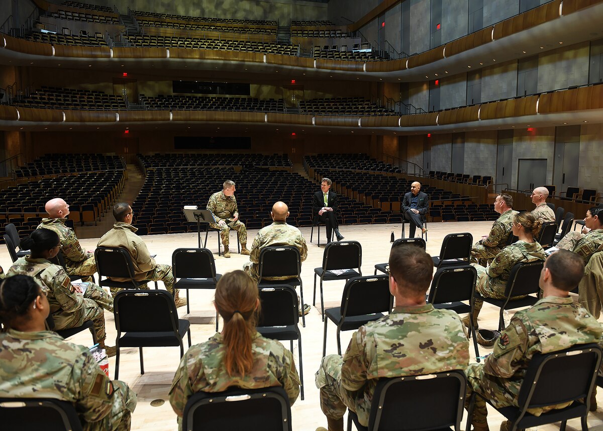 Military members participate in a leadership talk