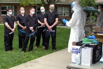 Col. Adam Colombo, senior medical adviser for Task Force South, trains Task Force Iroquois personnel on proper personal protective equipment procedures at Hickory House Nursing Home in Honey Brook, Pa., on May 22, 2020. Under guidance from the Pennsylvania Department of Health, and closely monitored by CDC officials, Pennsylvania National Guard members with Task Force Iroquois, launched a Point Prevalence Sampling Strike Team at the facility.
