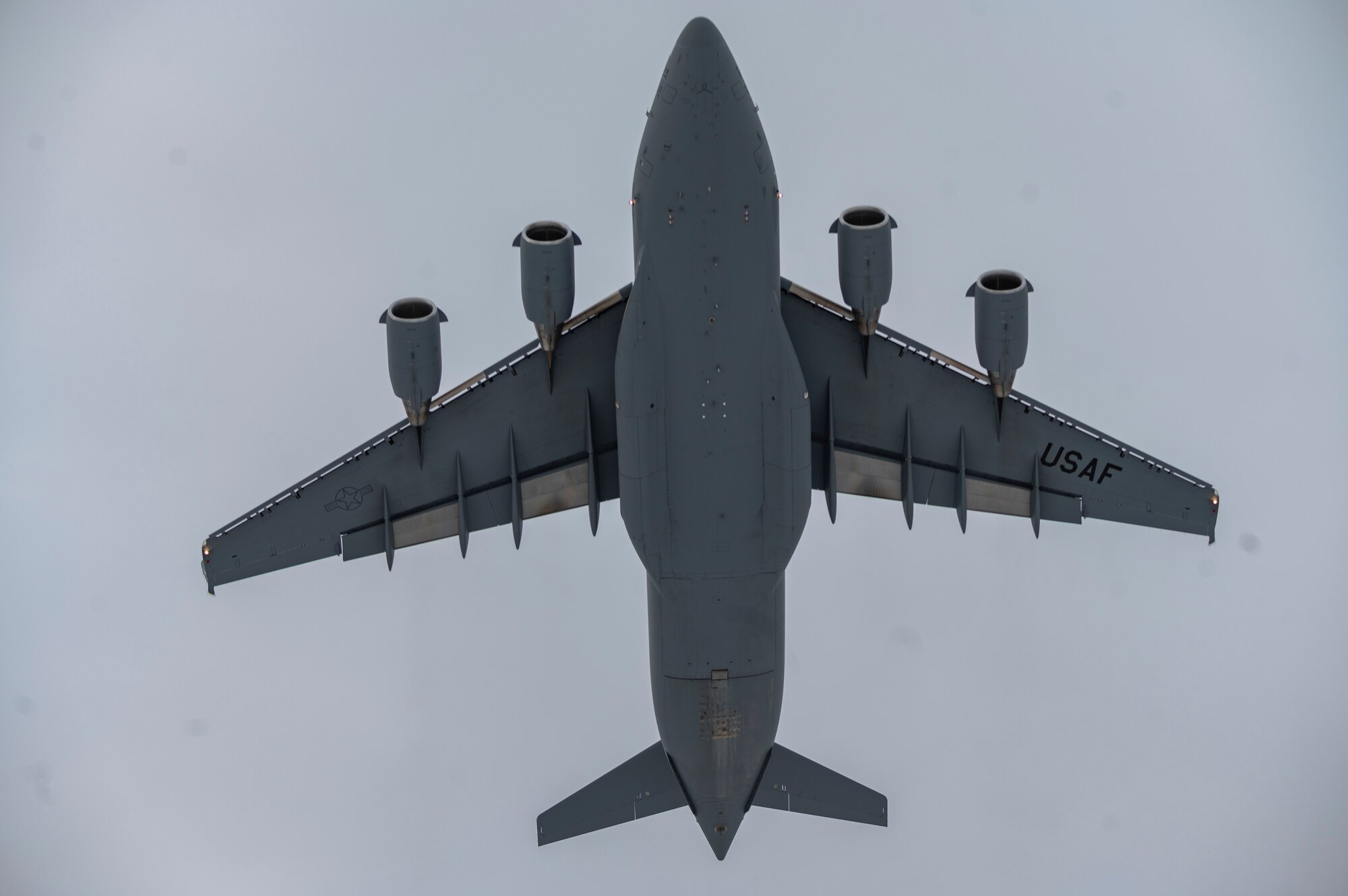 A C-17 Globemaster III assigned to Joint Base Lewis-McChord, Washington, takes off from a runway during Exercise Rainier War 22A at Joint Base Elmendorf-Richardson, Alaska, March 18, 2022. The exercise is designed to demonstrate the wing’s ability to operate and survive while defeating challenges to the U.S. military advantage in all operating domains – air, land, sea and cyberspace.(U.S. Air Force photo by Airman 1st Class Charles Casner)