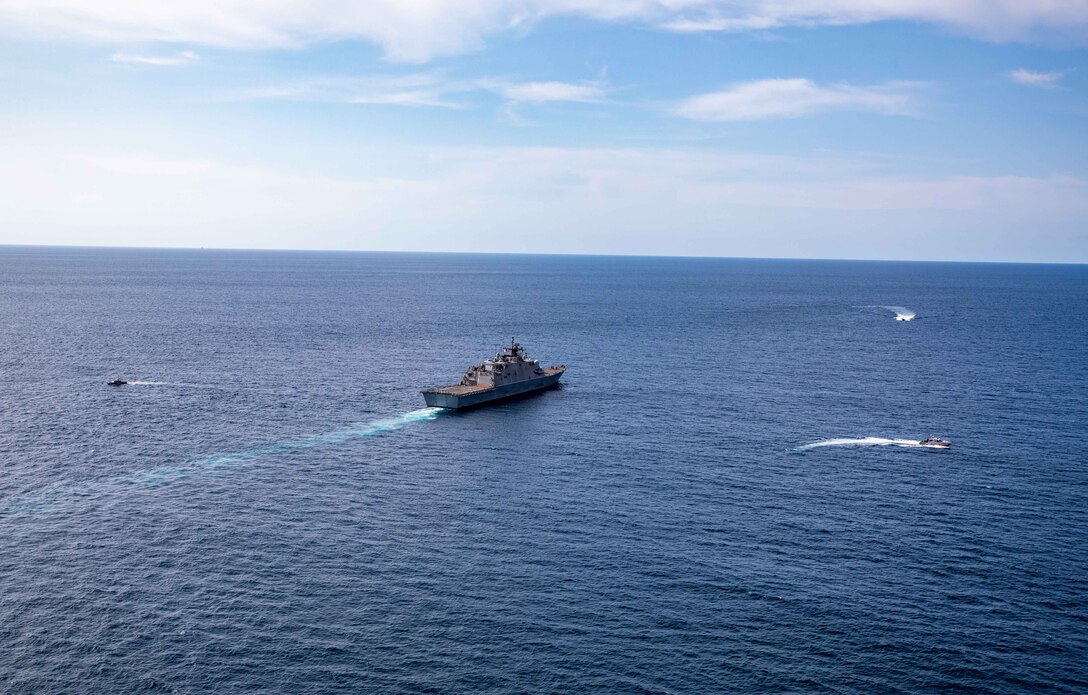 EASTERN PACIFIC OCEAN - (March 21, 2022) -- The Freedom-variant littoral combat ship USS Milwaukee (LCS 5), her 11-meter rigid-hull inflatable boat (RHIB), and Ecuadorian Coast Guard vessels LAE Rio Jubones (LG-120) and LAE Rio Tangare (LG-128), conduct a bilateral maritime interdiction exercise off the coast of Manta, Ecuador, March 21, 2022. Milwaukee is deployed to the U.S. 4th Fleet area of operations to support Joint Interagency Task Force South’s mission, which includes counter-illicit drug trafficking missions in the Caribbean and Eastern Pacific. (U.S. Navy photo by Mass Communication Specialist 2nd Class Danielle Baker/Released)