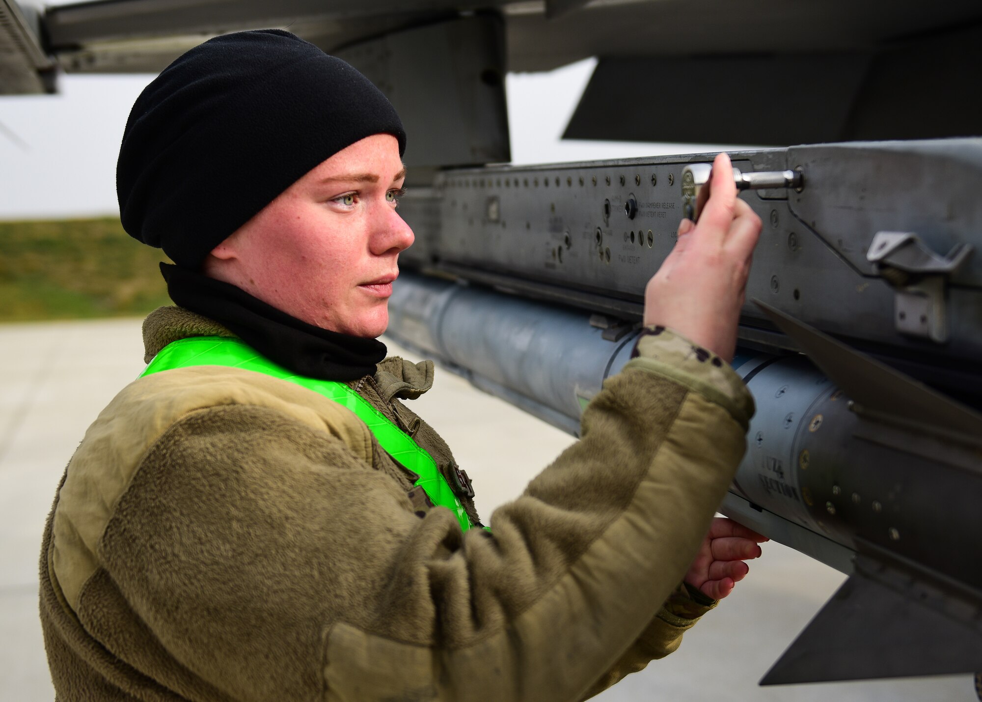 Senior Airman Kiara Beyer, 555th Aircraft Maintenance Unit weapons load crew member from the 31st Fighter Wing, Aviano Air Base, Italy, checks the security of munitions on a U.S. Air Force F-16C Fighting Falcon at Croatia’s 91st Air Base at Pleso, March 17, 2022. The 31st FW executed routine Agile Combat Employment operations with Croatian Allies. Missions such as these enhance the readiness necessary to respond to any potential challenge in Southeast Europe. (U.S. Air Force photo by Tech. Sgt. Miquel Jordan)