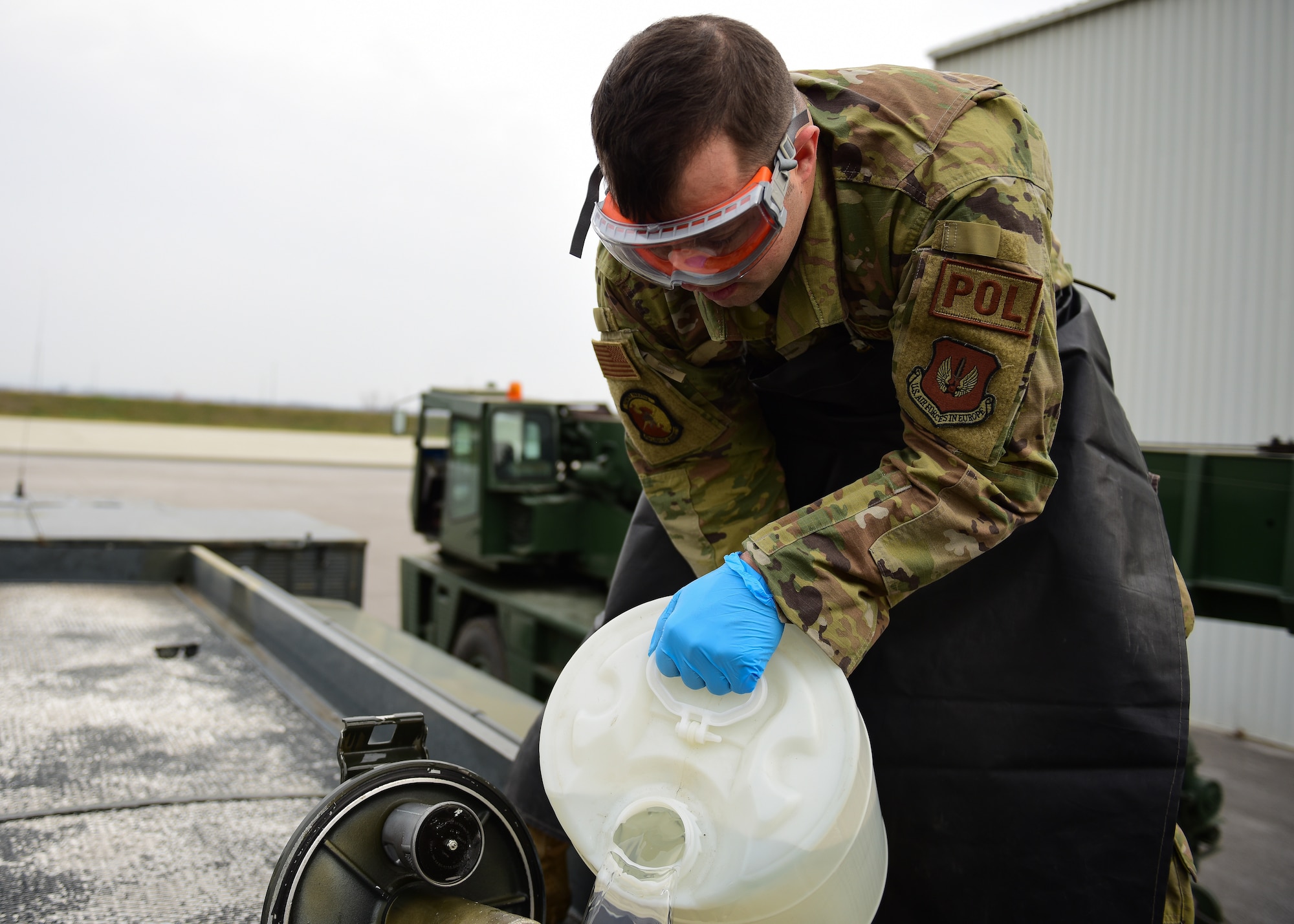 Staff Sgt. Kyle King, 31st Logistics Readiness Squadron fuels servicing noncommissioned officer in charge from Aviano Air Base pours fuels systems icing inhibitor into a R-11 Mobile Refueling unit fuel tank to turn commercial grade jet fuel into Air Force-regulated fuel at Croatia’s 91st Air Base at Pleso, March 16, 2022, in preparation for the arrival of two F-16C Fighting Falcons from the 31st Fighter Wing. The 31st FW focus is to execute routine Agile Combat Employment concepts alongside Croatian Allies while supporting NATO’s collective defense in Southeast Europe.  (U.S. Air Force photo by Tech. Sgt Miquel Jordan)