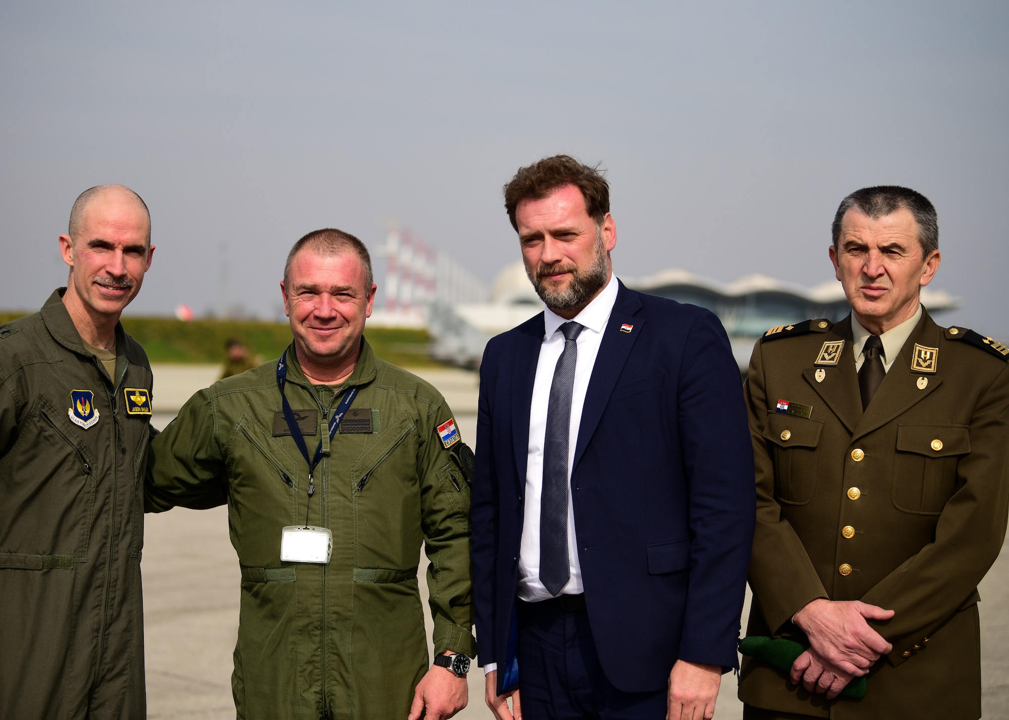 U.S. Air Force Brig. Gen. Jason E. Bailey, 31st Fighter Wing commander, Aviano Air Base, Italy, poses for a photo with Croatian Defense Minister Mario Banožić and members of the Croatian Air Force after a press conference to stress the importance of the Agile Combat Employment operations between the two Allies at Croatia’s 91st Air Base at Pleso, March 17, 2022. The 31st FW executed routine ACE operations with Croatian Allies in a mission to enhance the readiness necessary to respond to any potential challenge in Southeast Europe. (U.S. Air Force photo by Tech. Sgt. Miquel Jordan)
