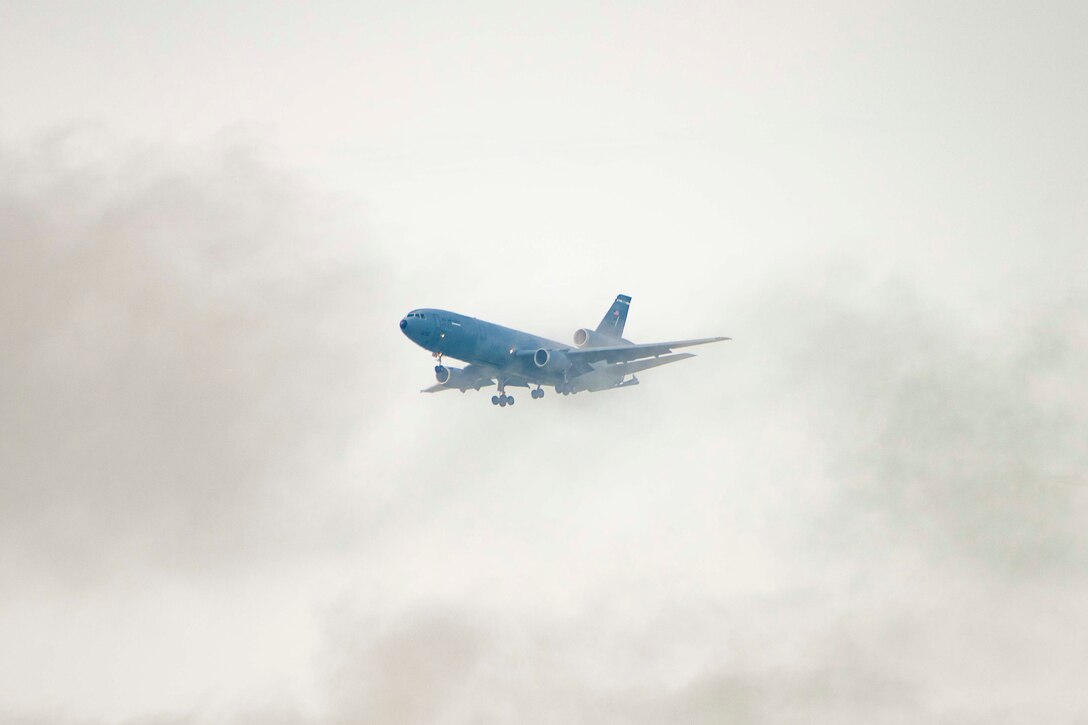 An airplane flies through clouds.