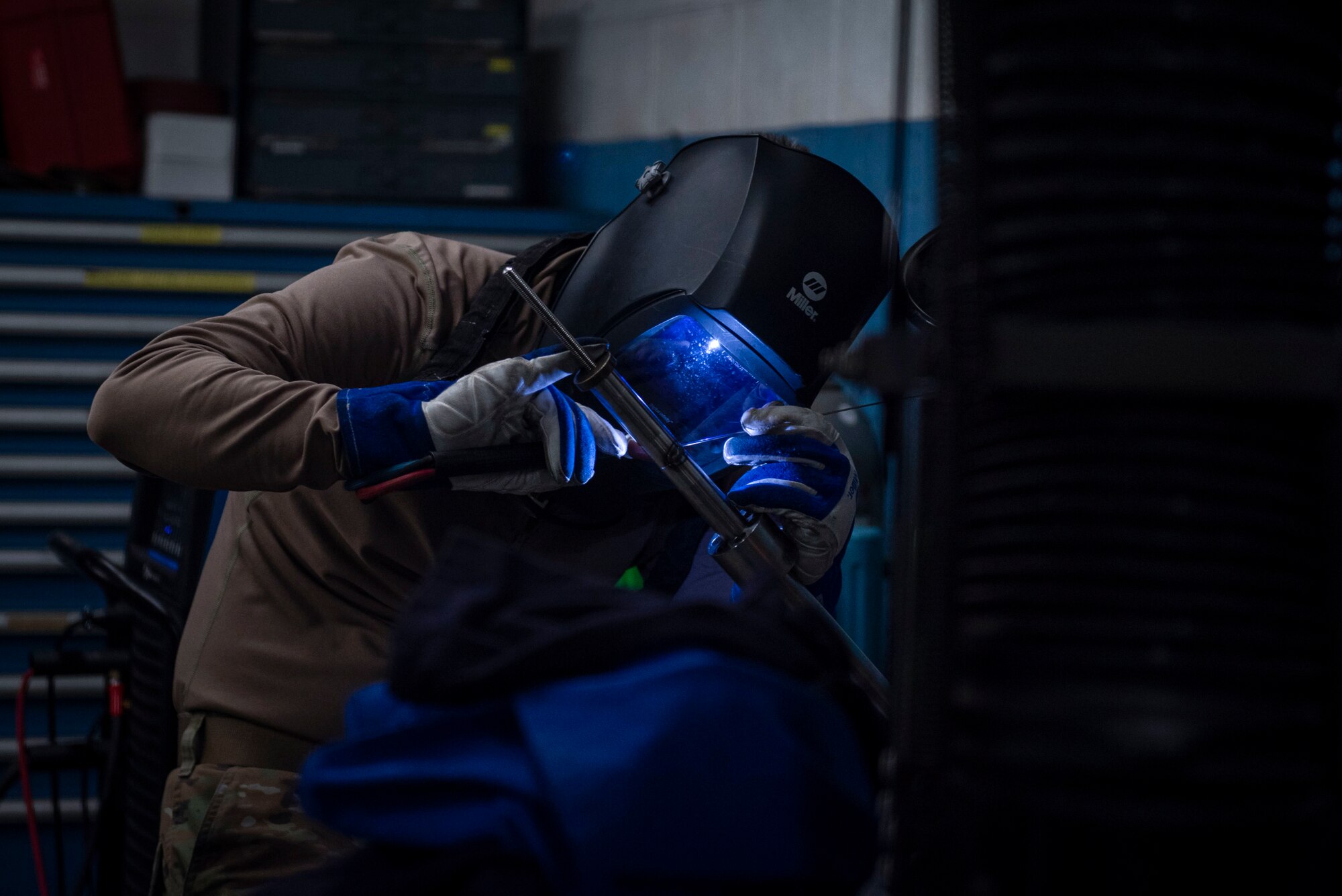 Airman 1st Class Shane Turner, 4th Equipment Maintenance Squadron aircraft metal technician, welds metal together at Seymour Johnson Air Force Base, North Carolina, Feb. 2, 2020. The metal is heated to 1,200 degrees Fahrenheit before it can weld together. Maintainers are responsible for ensuring the airworthiness of aircraft. (U.S. Air Force photo by Airman 1st Class Sabrina Fuller)