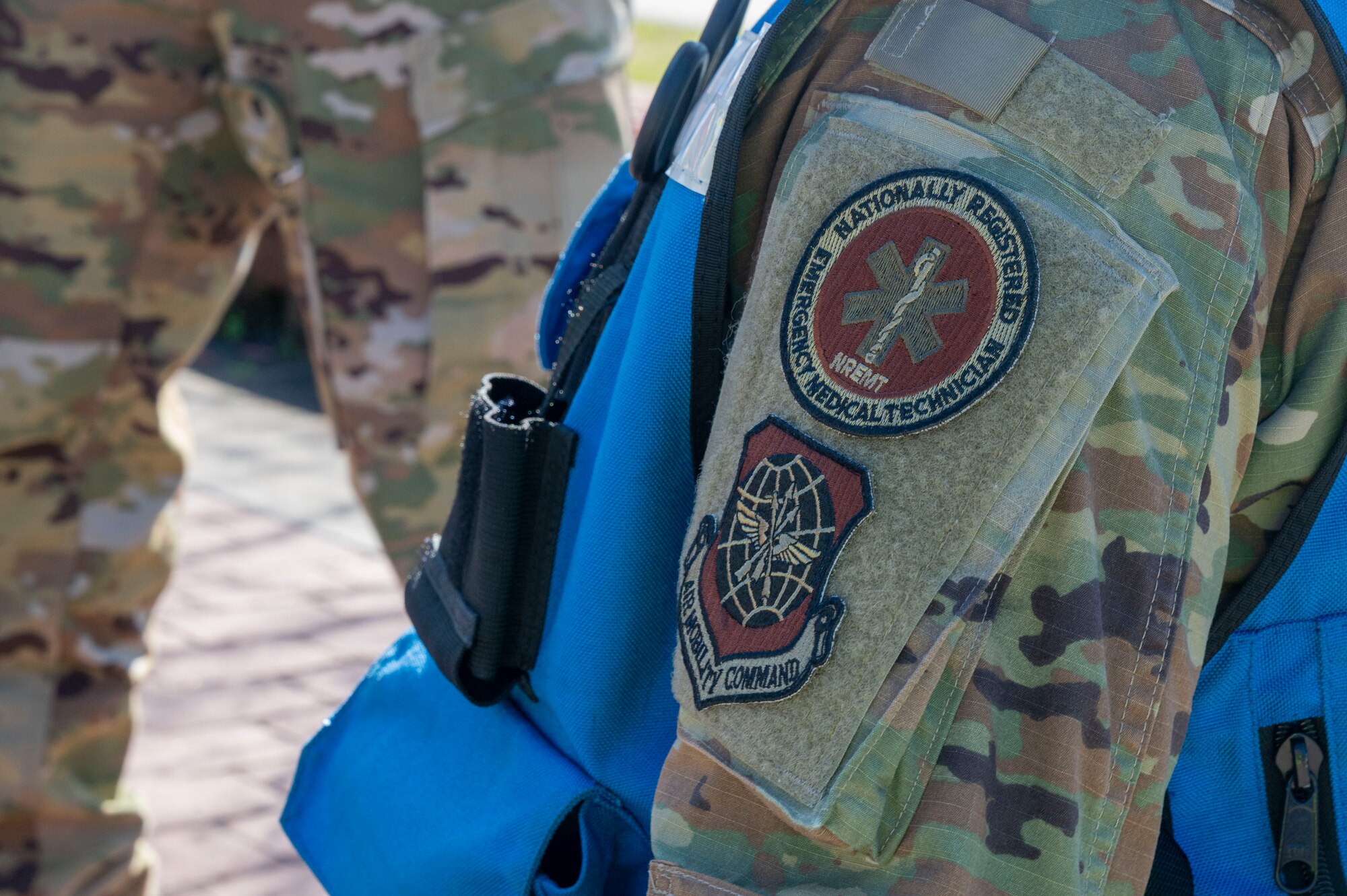 An emergency medical technician assigned to the 19th Operational Medical Readiness Squadron stands by to render aid during