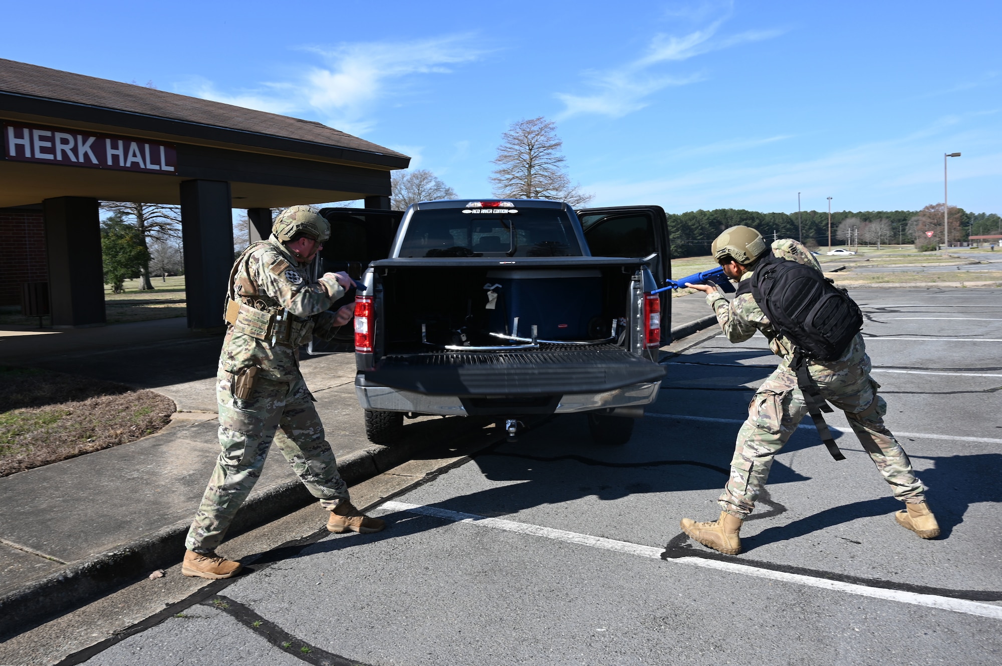 Airmen assigned to the 19th Security Forces Squadron search a vehicle