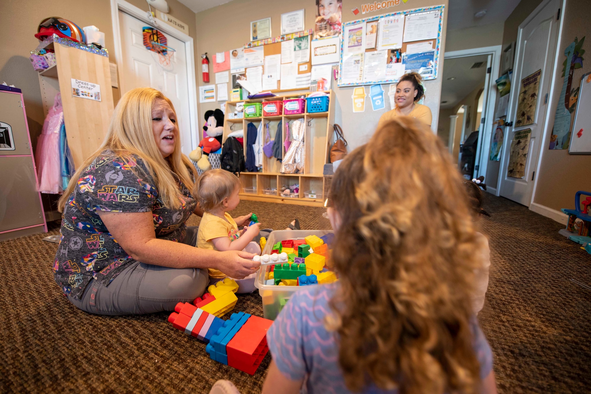 Woman plays with children
