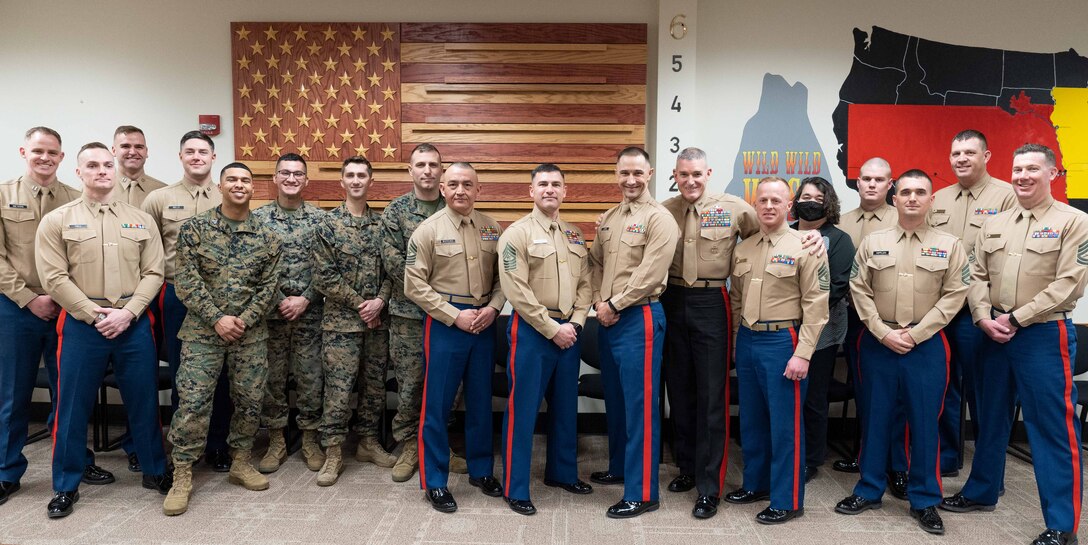Major General Jason Q. Bohm poses for a photo with the headquarters element of Recruiting Station Des Moines, Iowa, Mar. 23, 2022. Bohm visited the Marines of RS Des Moines, apart of his tour across the 9th Marine Corps District.