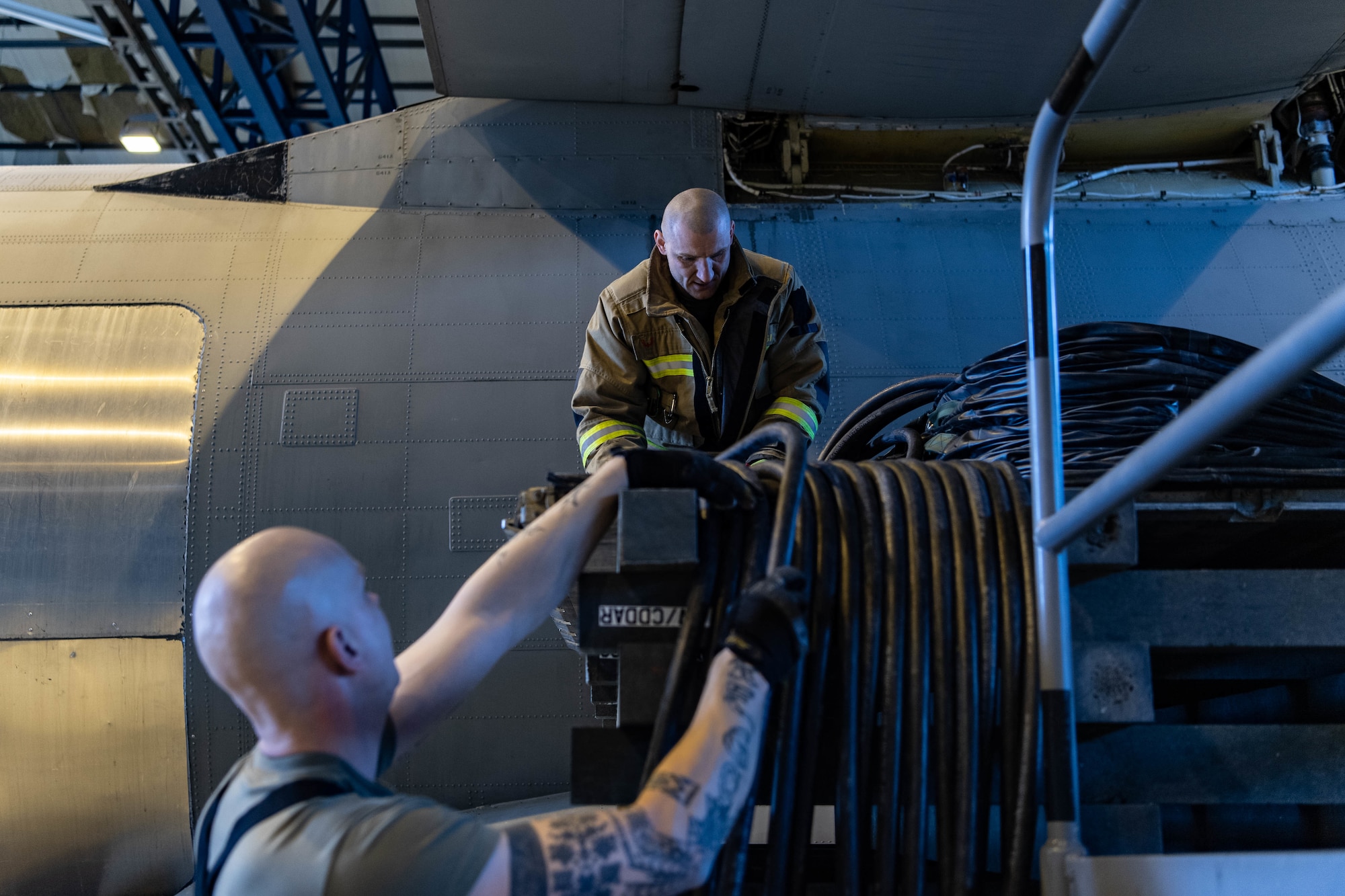 firefighter fills an airbag.