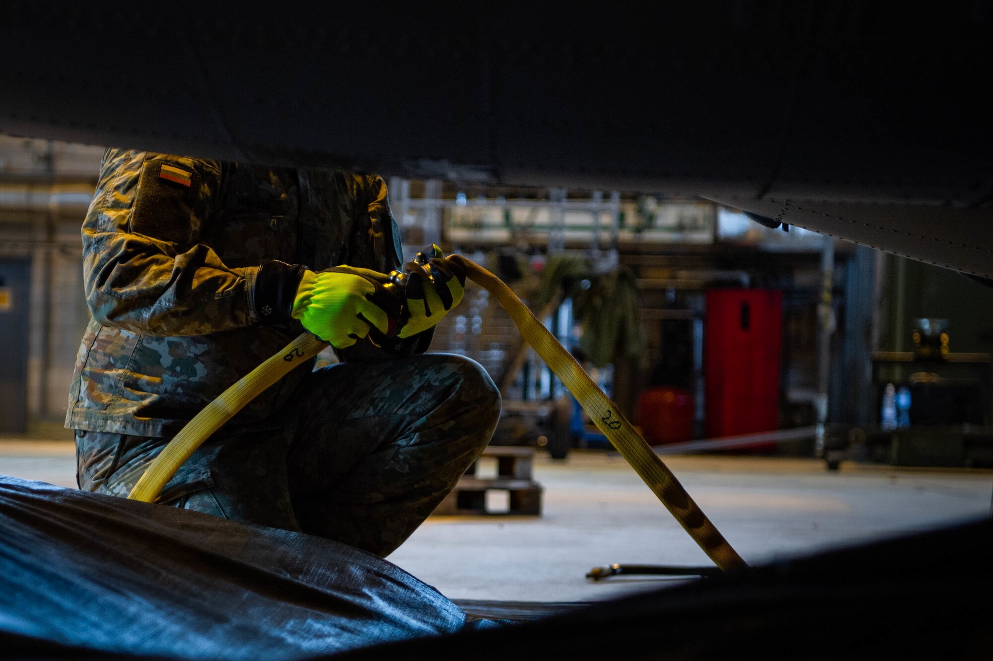firefighter fills an airbag.