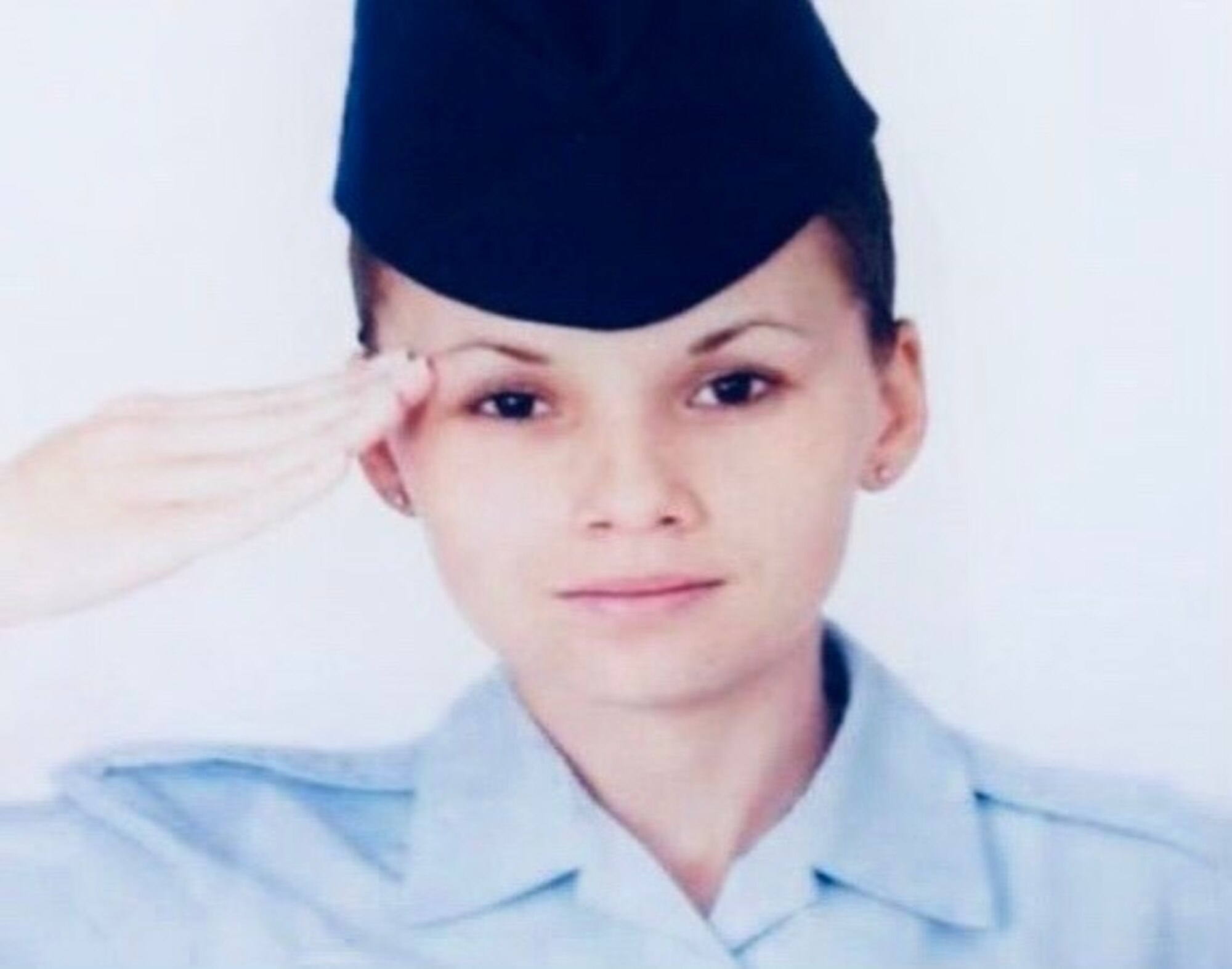 Senior Airman Hicks saluting