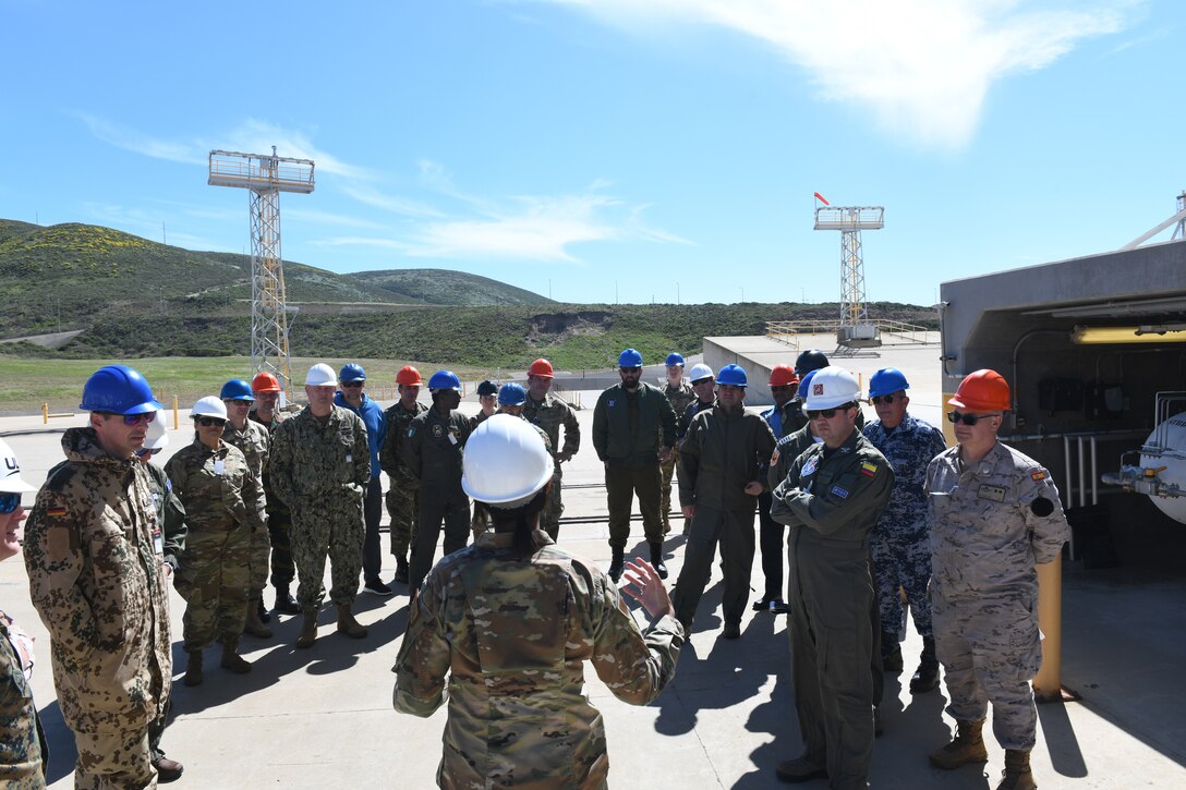 U.S. Air Force 2nd Lt. Ashley Barclift, National Security Space Launch Responsible Engineer, leads the Air War College group around Space Launch Complex 6 on Vandenberg Space Force Base, Calif., March 14, 2022. Having allied officers from the around the globe visit Vandenberg further strengthen strategic relationships that assist in dominating air, space, and cyberspace. (U.S. Space Force photo by Airman 1st Class Ryan Quijas)