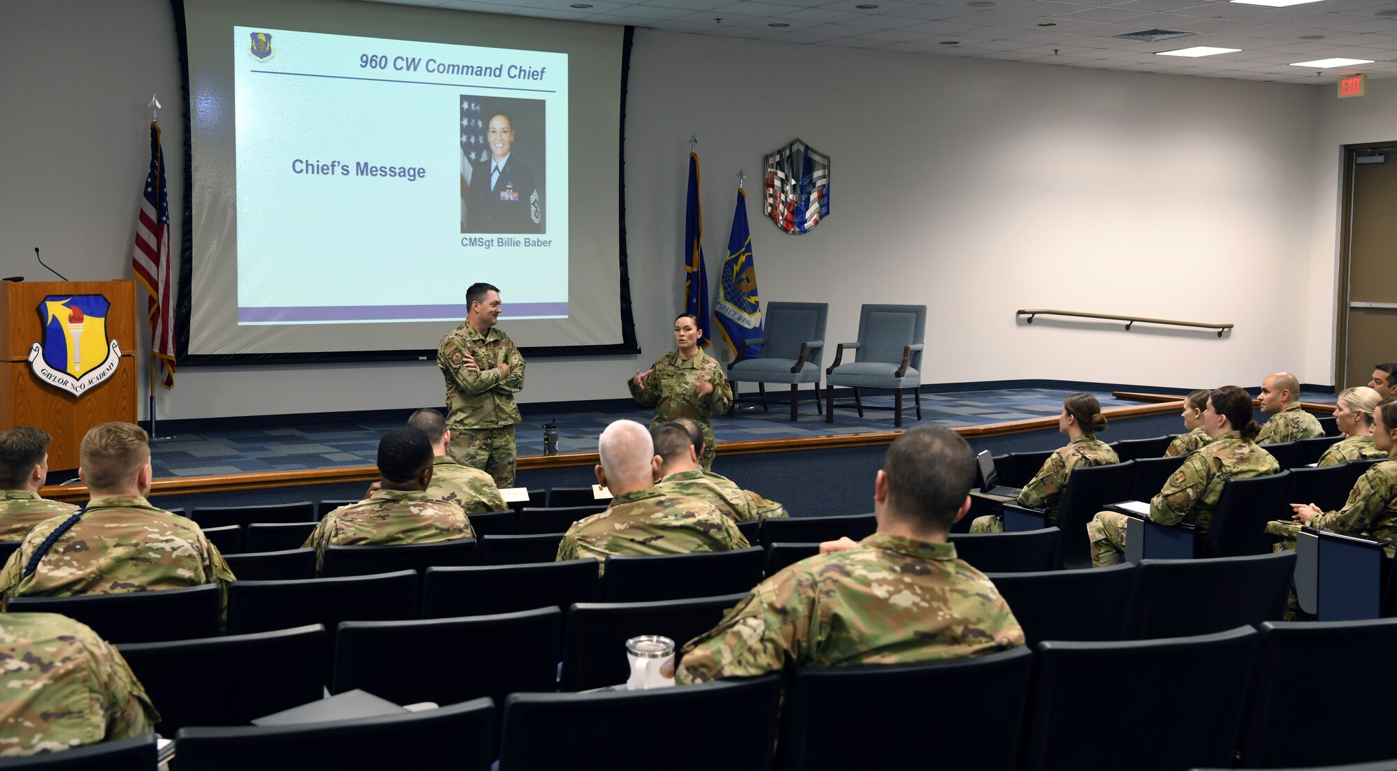 Col. Richard Erredge, 960th Cyberspace Wing commander, and Chief Master Sgt. Billie Baber, 960th CW command chief, speak during the opening session of the inaugural 960th CW Additional-Duty First Sergeants’ Symposium March 7, 2022, at Joint Base San Antonio-Lackland, Texas. The symposium provided training and networking opportunities to more than 55 Reserve, Guard and active-duty members. (U.S. Air Force photo by Kristian Carter)