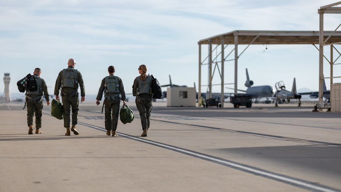 Flight crews walk on the flightline toward their aicraft prior to a training sortie at Edwards Air Force Base, California, March 3. (Air Force photo by Bryce Bennett)