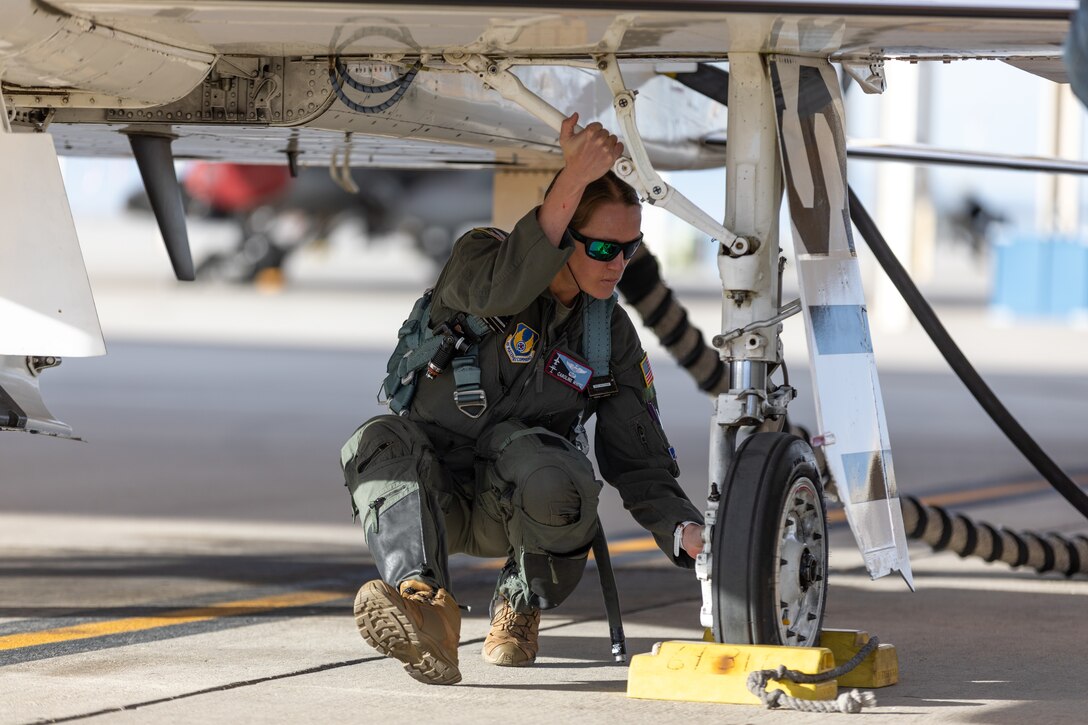 Caroline White, 412th Operations Group Standards and Evaluations Deputy Chief, inspects her T-38 Talon prior to a training sortie at Edwards Air Force Base, California, March 3. (Air Force photo by Bryce Bennett)