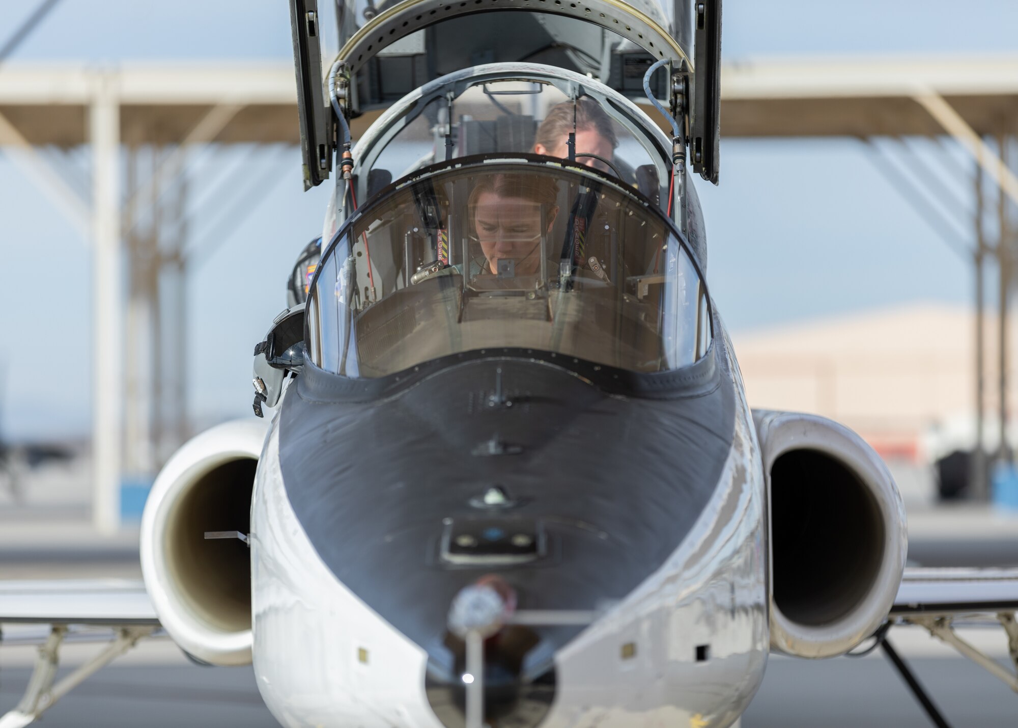 T-38 Talon pilot Caroline White, 412th Operations Group Standards and Evaluations Deputy Chief, and Jess Peterson, 412th Operations Group Technical Director, prepare to conduct a training sortie from Edwards Air Force Base, California, March 3. (Air Force photo by Bryce Bennett)