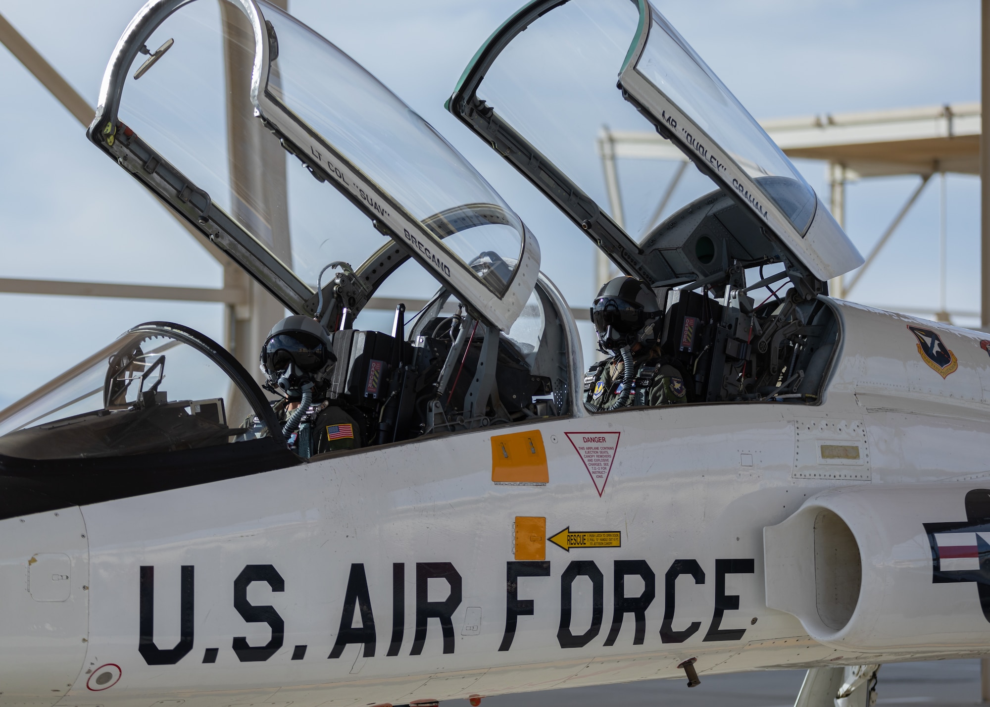 T-38 Talon pilot Caroline White, 412th Operations Group Standards and Evaluations Deputy Chief, and Jess Peterson, 412th Operations Group Technical Director, prepare to conduct a training sortie from Edwards Air Force Base, California, March 3. (Air Force photo by Bryce Bennett)