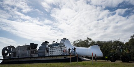 A CH-46 Sea Knight helicopter exits the Navy Landing Craft Air Cushion (LCAC) 103 vehicle after successful transport to Eglin Air Force Base, Fla., Feb. 24. This is one example of how the LCAC from Naval Surface Warfare Center Panama City Division capability aligns with Naval Sea Systems Command (NAVSEA) strategic goals at the division level by demonstrating its ability to deliver an array of responsive options and services to meet real world needs. (U.S. Air Force photo/Samuel King Jr.)